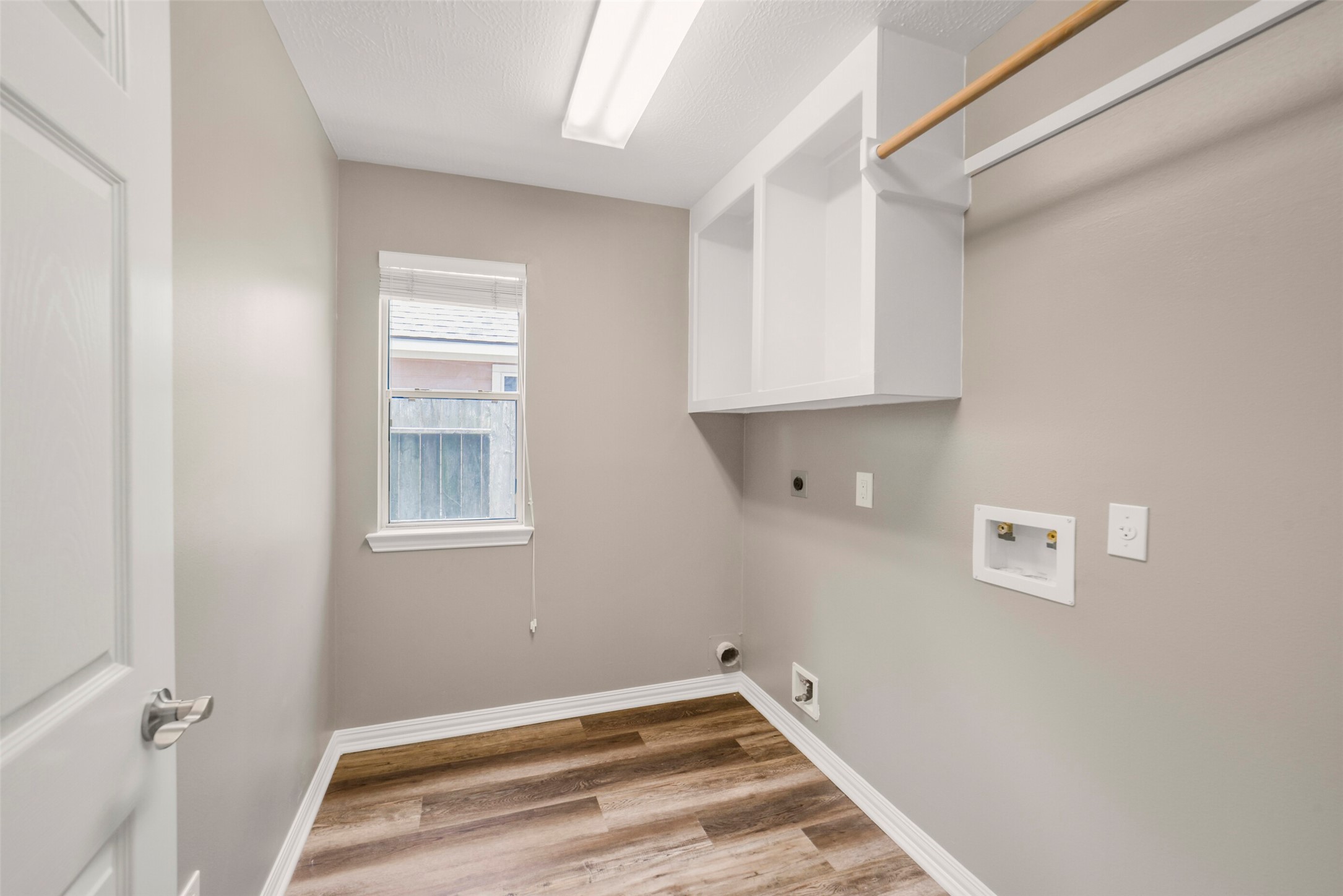 The dedicated utility/laundry room offers excellent functional space, built-in storage, and convenient organizing options.