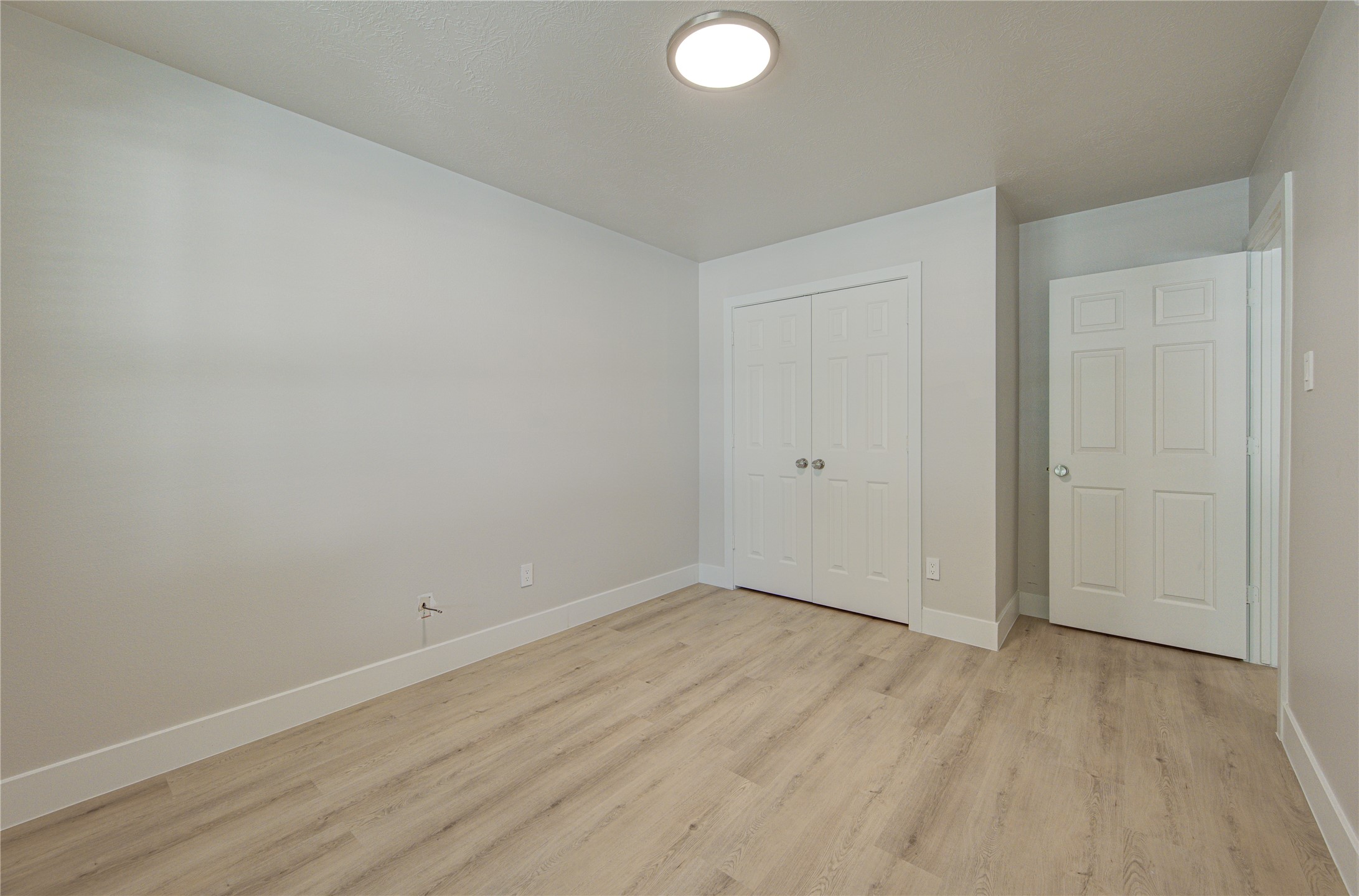 Generous closet space and clean, modern finishes make this bedroom move-in ready and easy to personalize for any stage of life
