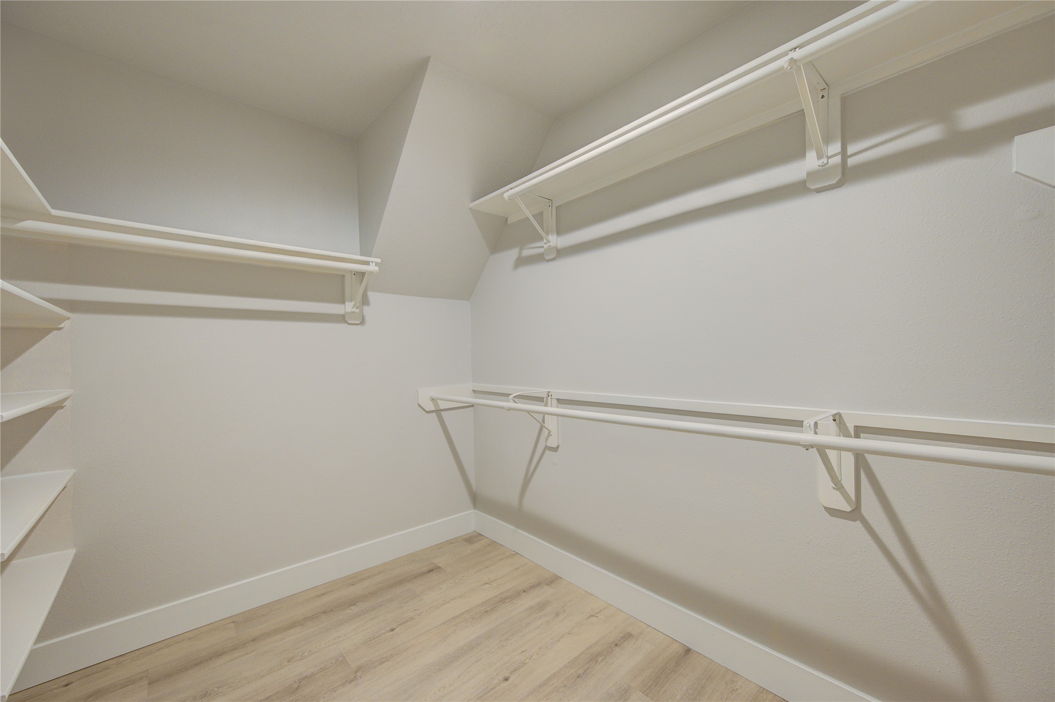 Generously sized walk-in closet, accessible from primary bath.