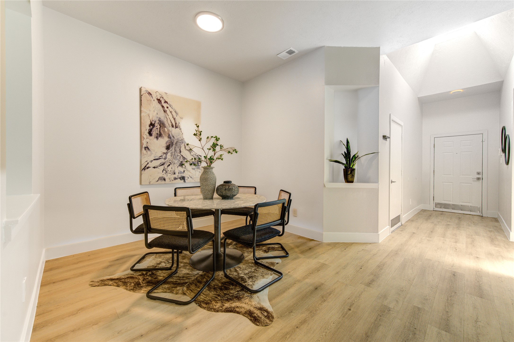 Staged flex space can be utilized as a formal dining room