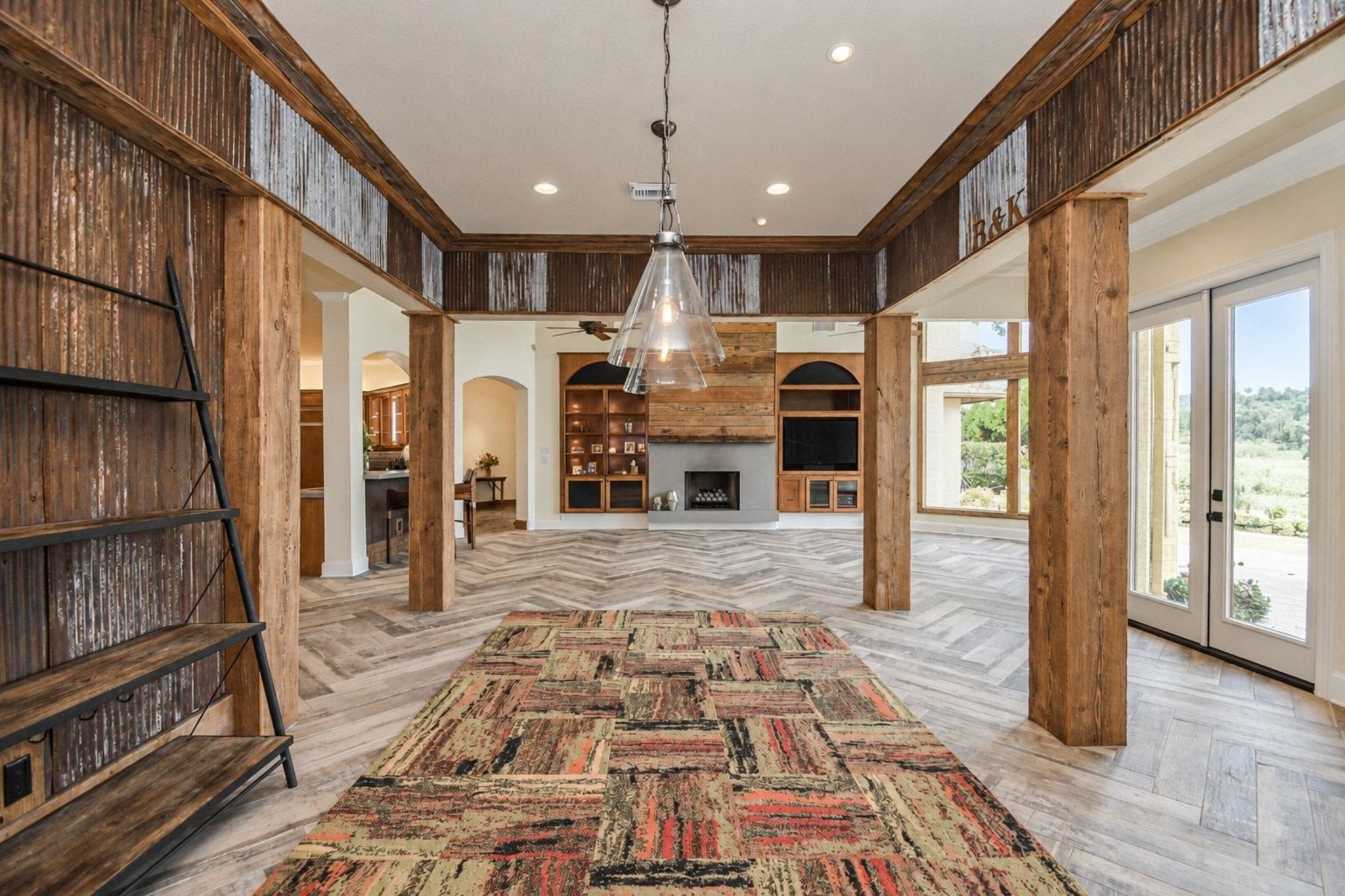 Open concept floor plan featuring a seamless transition from the formal dining room into the spacious living area, perfect for modern entertaining and everyday living!