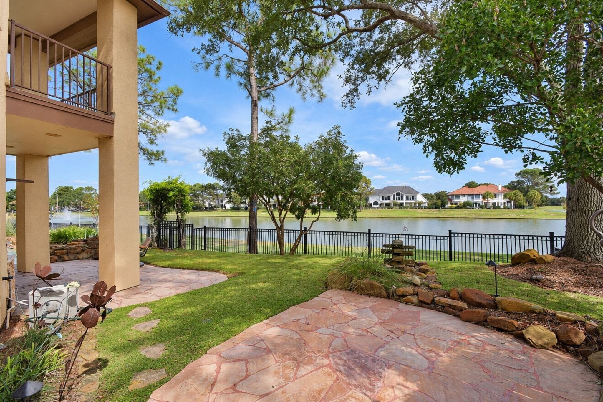 Outdoor seating area with breathtaking views of the surrounding landscape, perfect for sunset entertaining and quiet morning coffee. This private oasis features high-end finishes, ample space for lounge furniture, and panoramic vistas that highlight the beauty of the property's prime location!