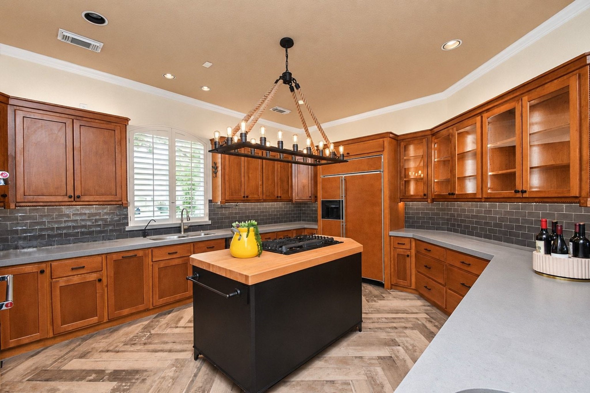 A cook's dream with custom cabinetry. This gourmet-inspired space features high-end finishes, ample storage, and meticulously crafted custom cabinetry designed for both functionality and elegance. Perfect for any culinary enthusiast, the kitchen provides a seamless blend of style and efficiency to elevate your cooking experience!