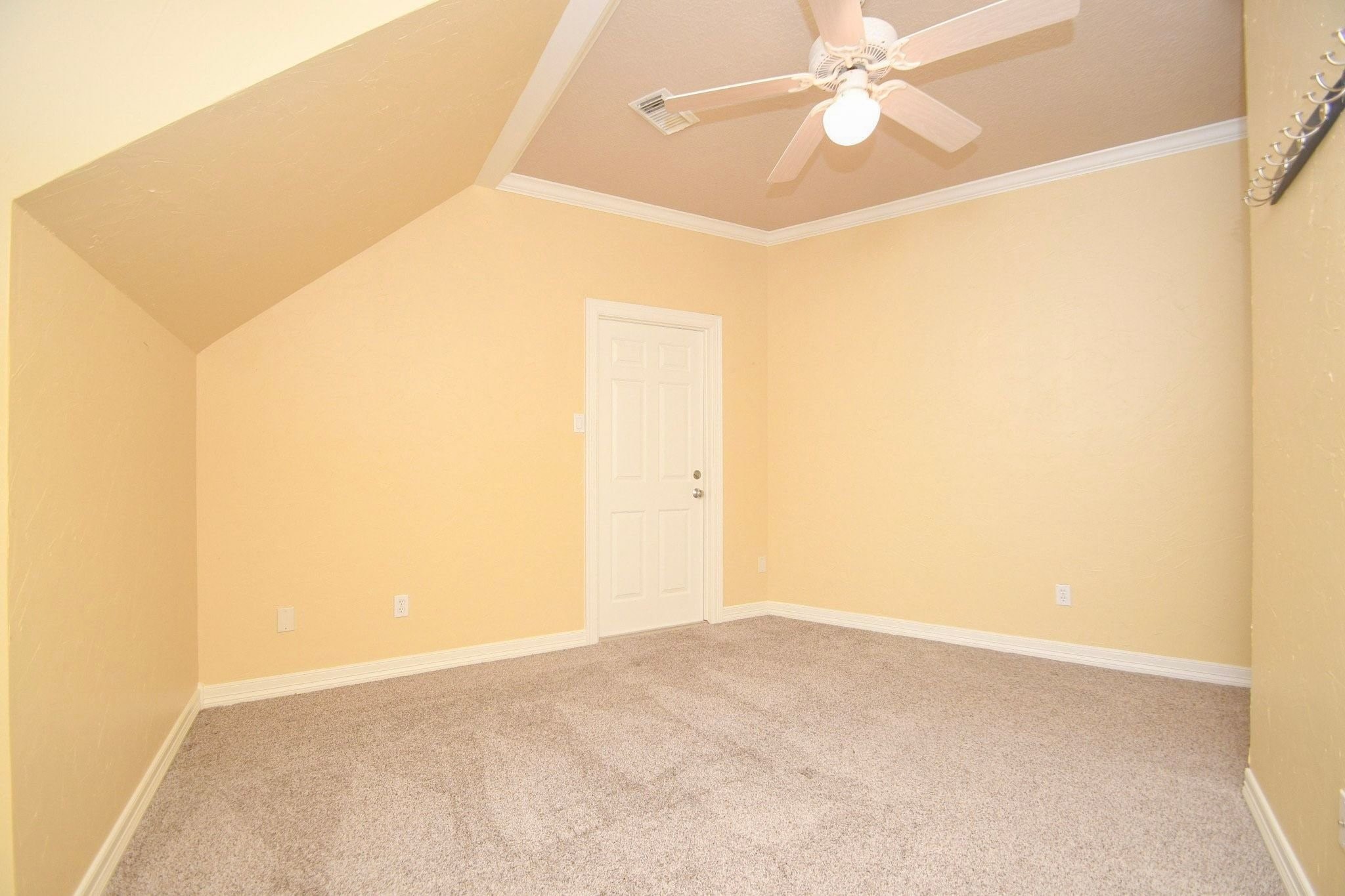 Another bedroom with ample space for sleep and play, featuring large windows that invite natural light and provide a versatile layout perfect for a restful sanctuary or a productive hobby area!