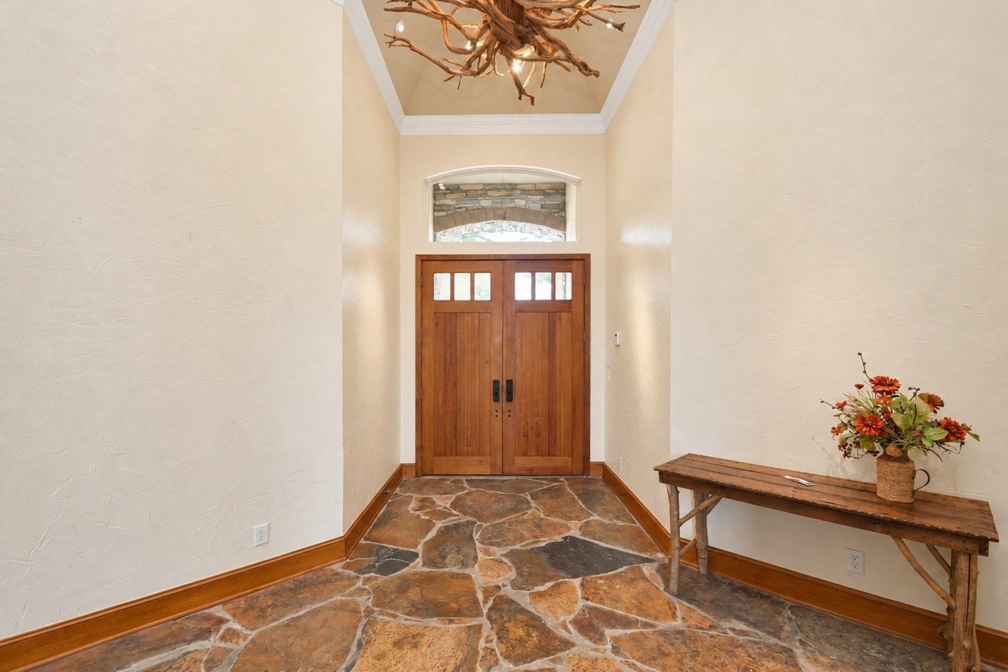 Entrance includes grand with slate floors and custom light fixtures!