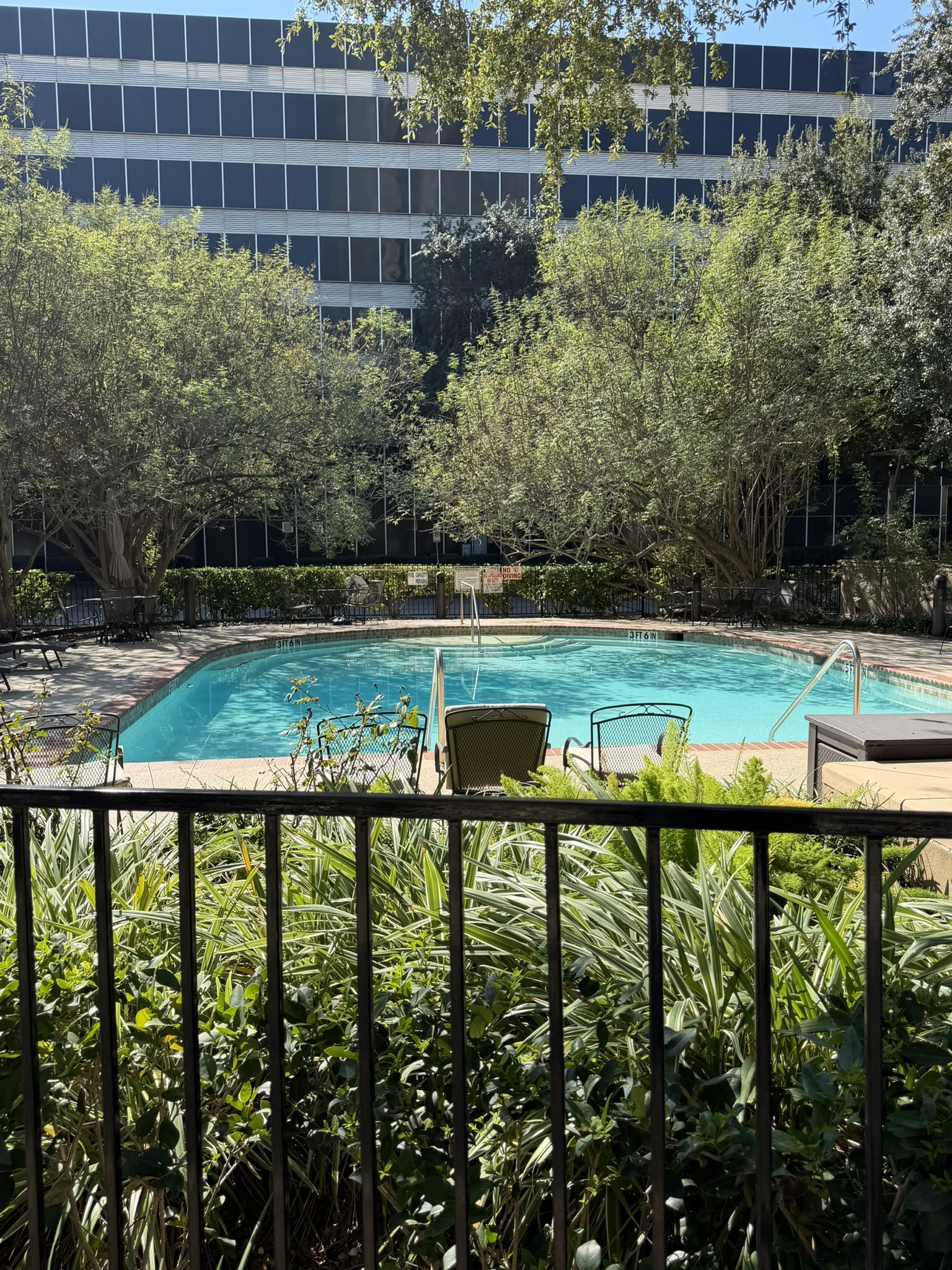 Pool in the front of building, nice views