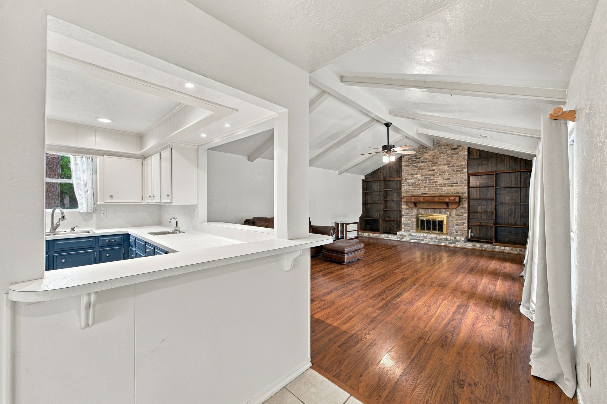 The open floor plan has living area to one side and the sleeping quarters to the other.
