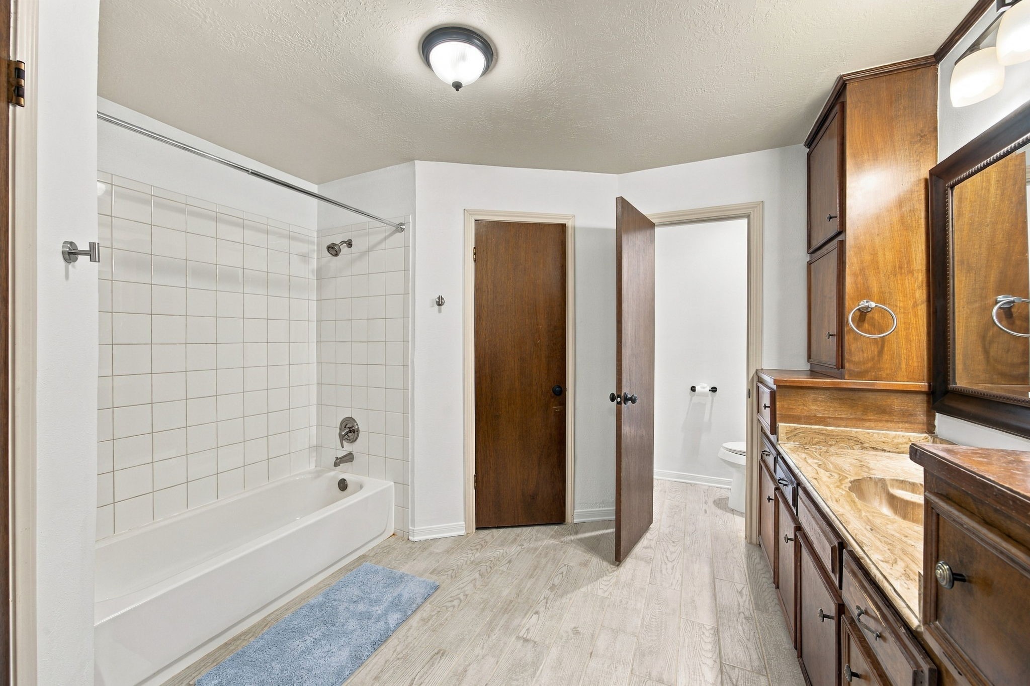 The primary bath has a tub/shower combo, double closets and a plenty of cabinet space.  The is also a seperate vanity