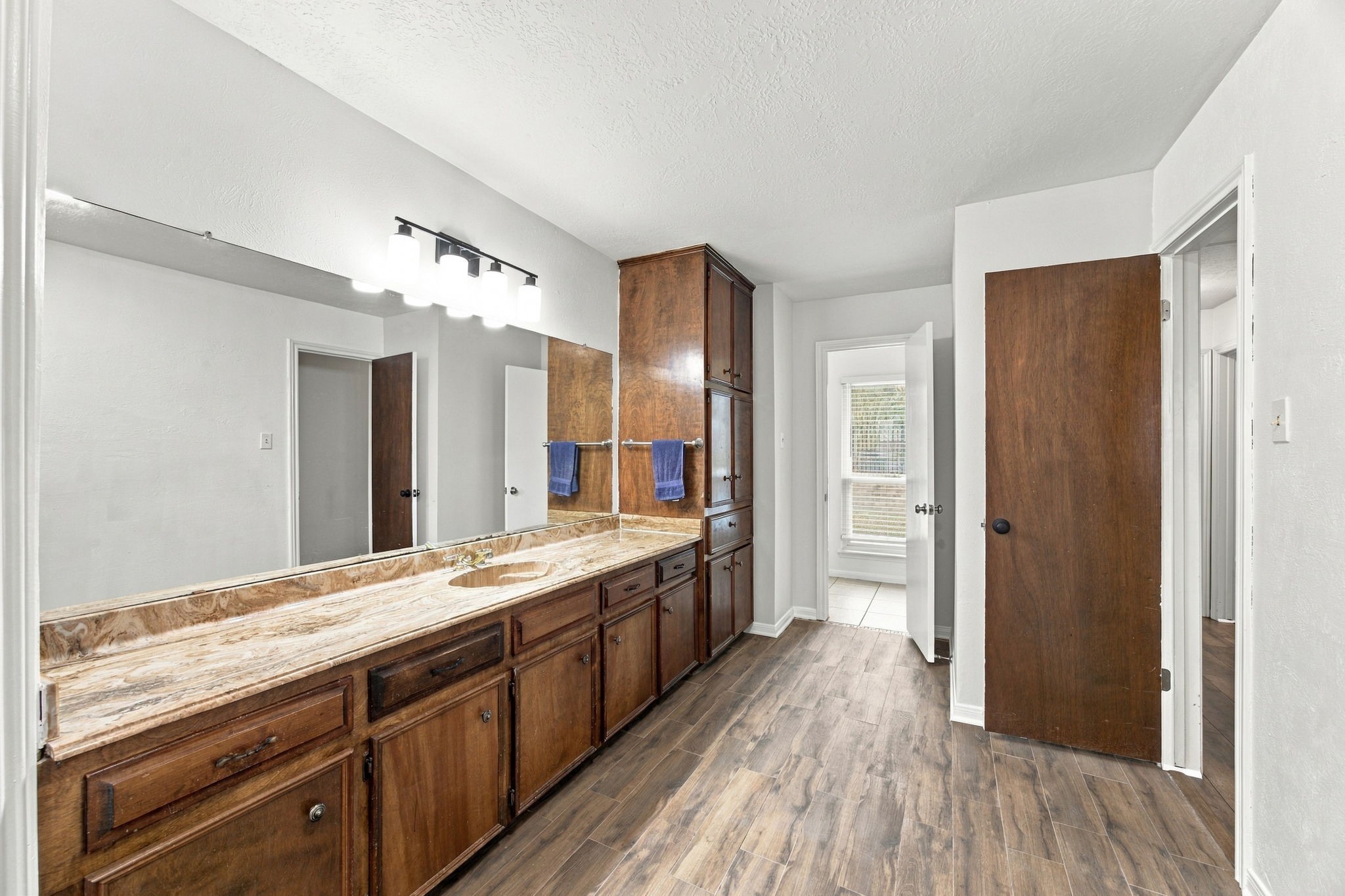 The size of the guest bathroom could easily be converted into an accessible bathroom.  The space is there.
