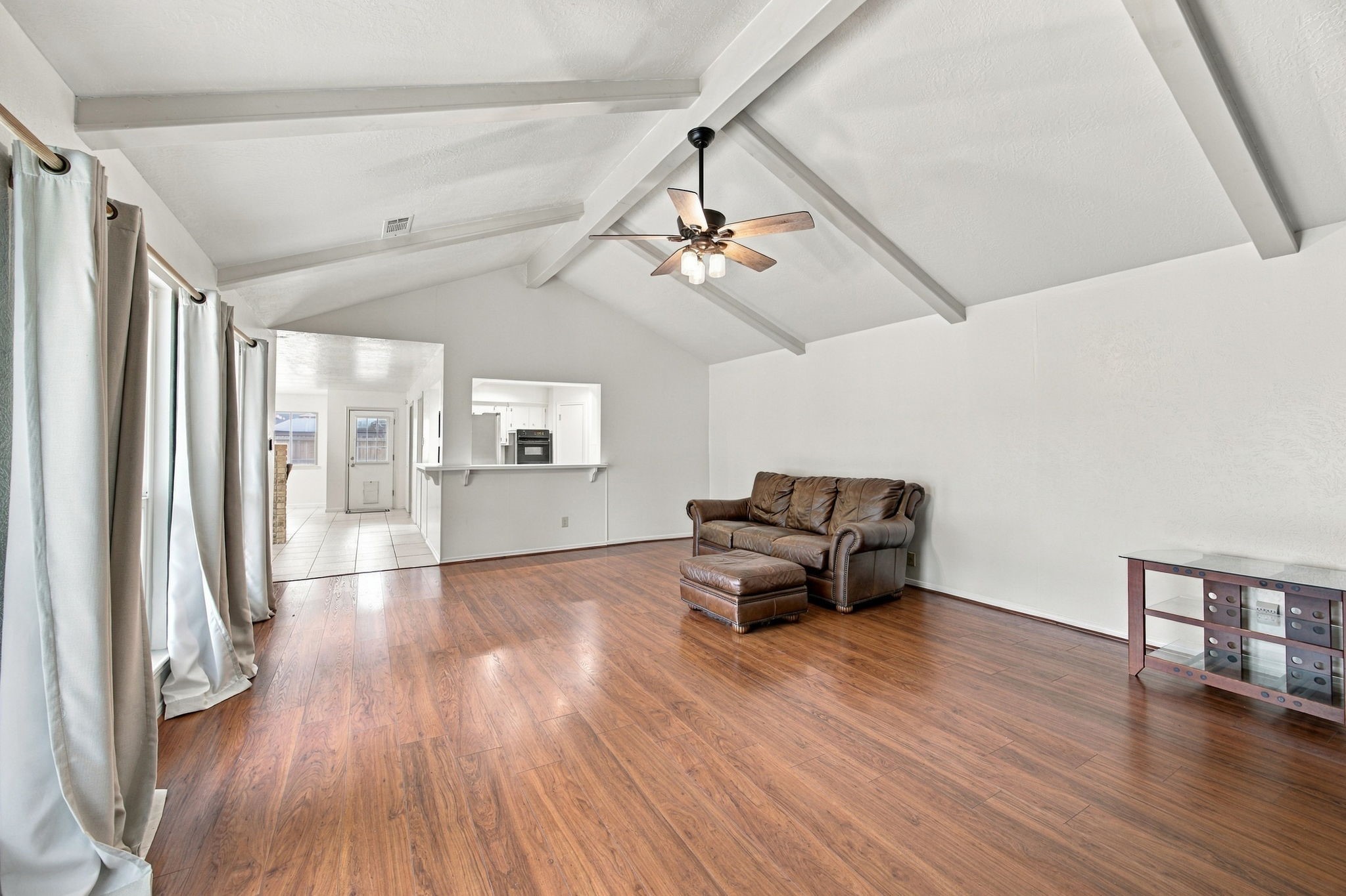 This large open living area has plenty of room for even the largest sectional. You could even split the room into a seating area as well.