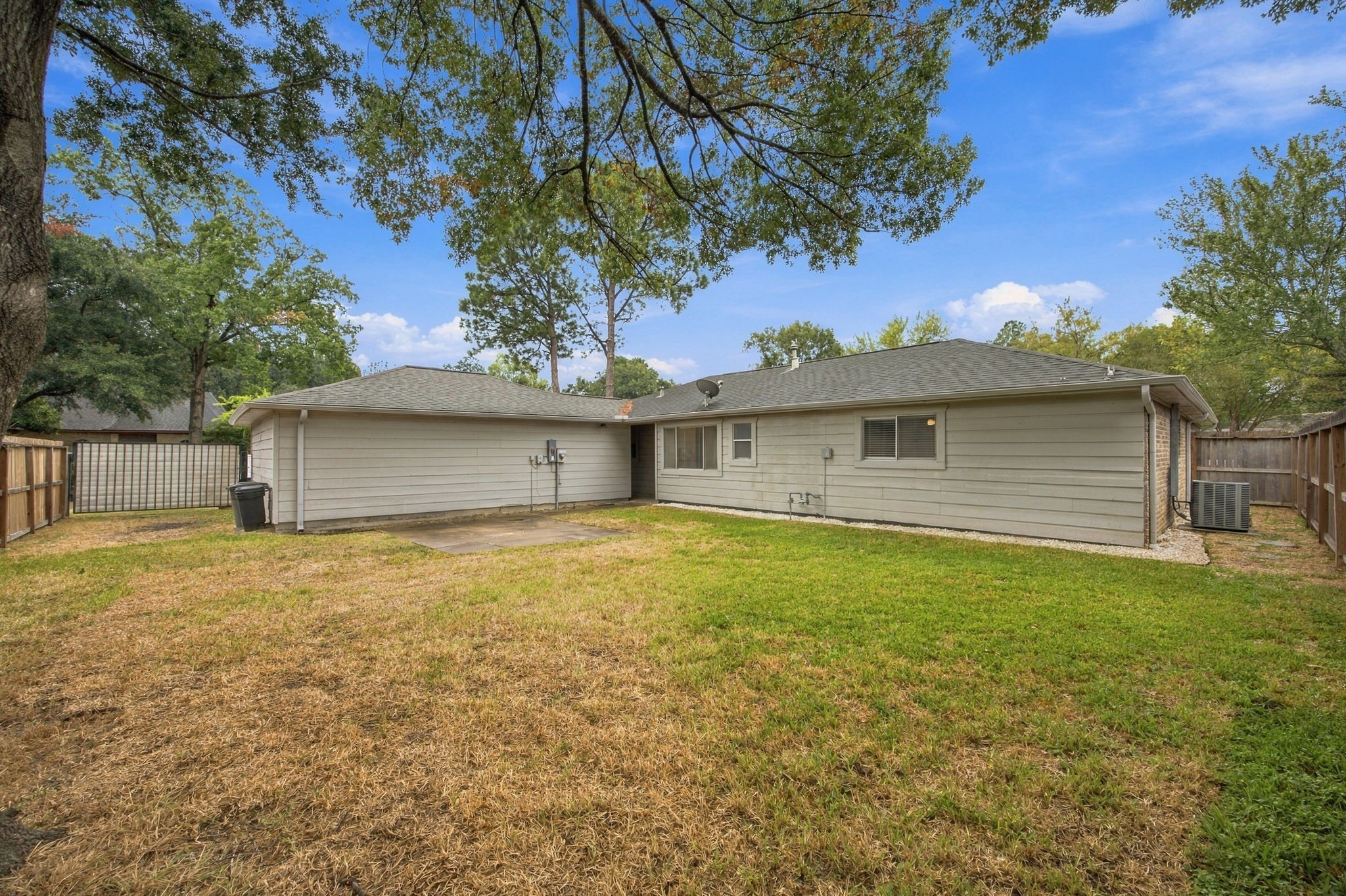 The backyard is a great size and blank slate.  You can see the extra parking gate behind the garage.