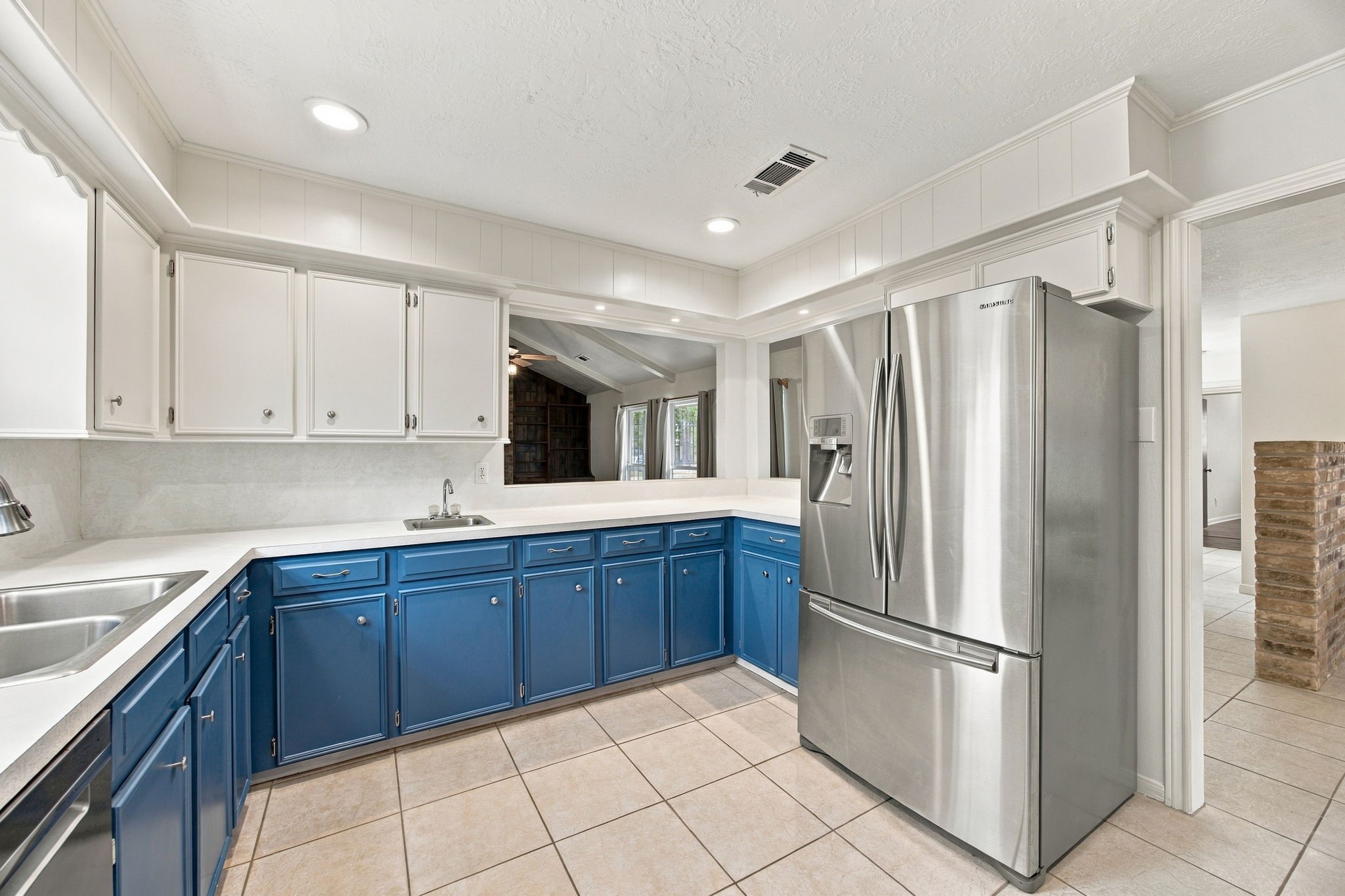 The space keeps going!  The extras wet bar sink can be used for entertaining as you pass you pass food and drink to the people in the living room.  The appliances stay.