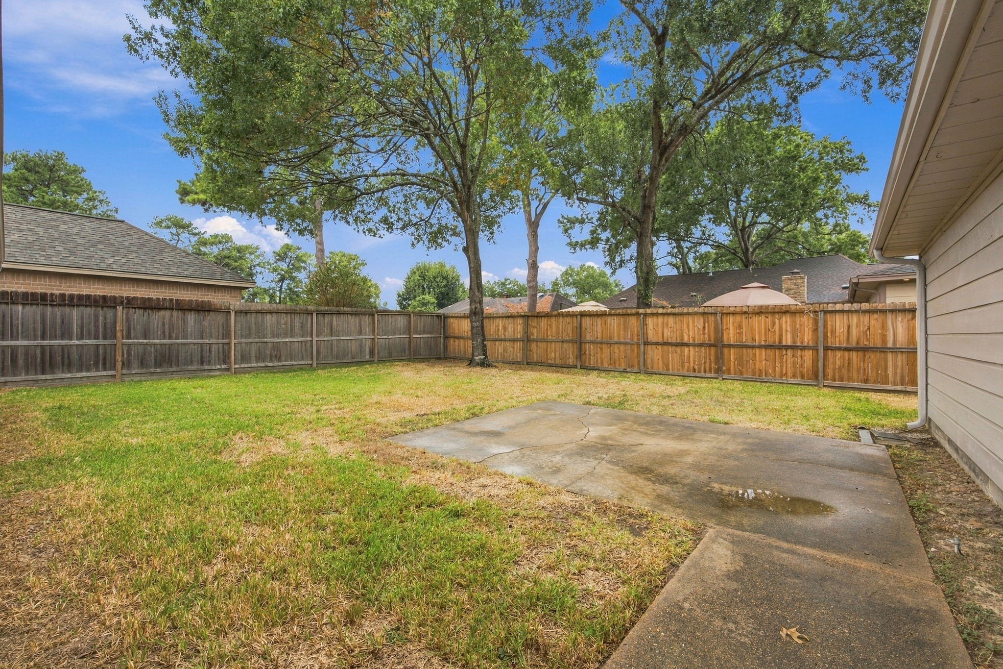 The back yard is wide open and ready for your ideas