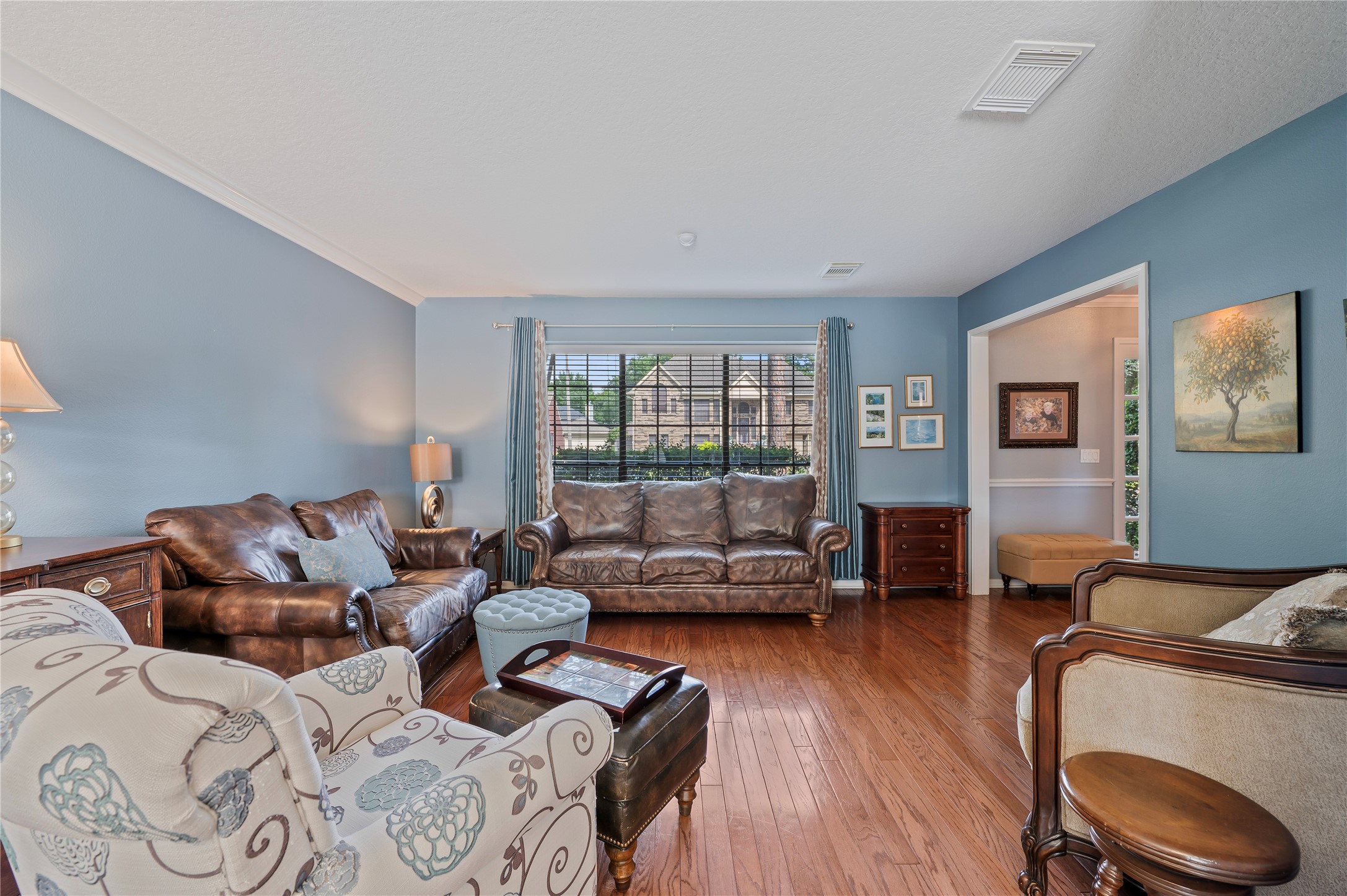 Another view of the living room with great natural light from the front windows.