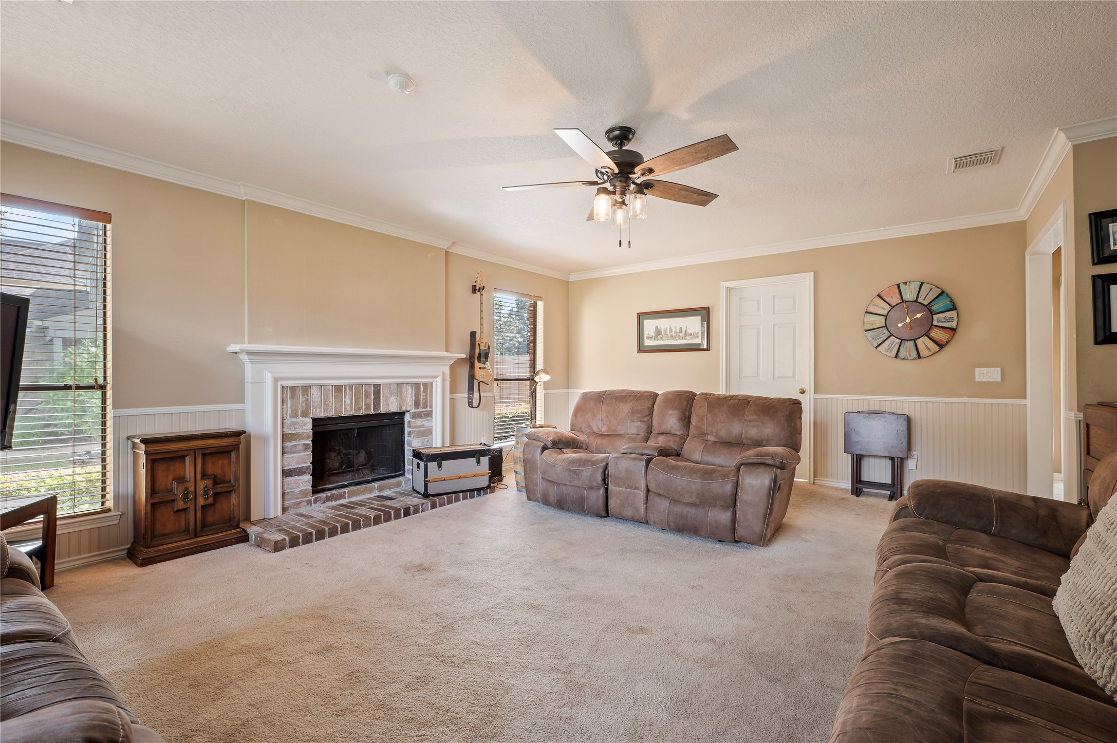 Another view of the spacious family room with fireplace.