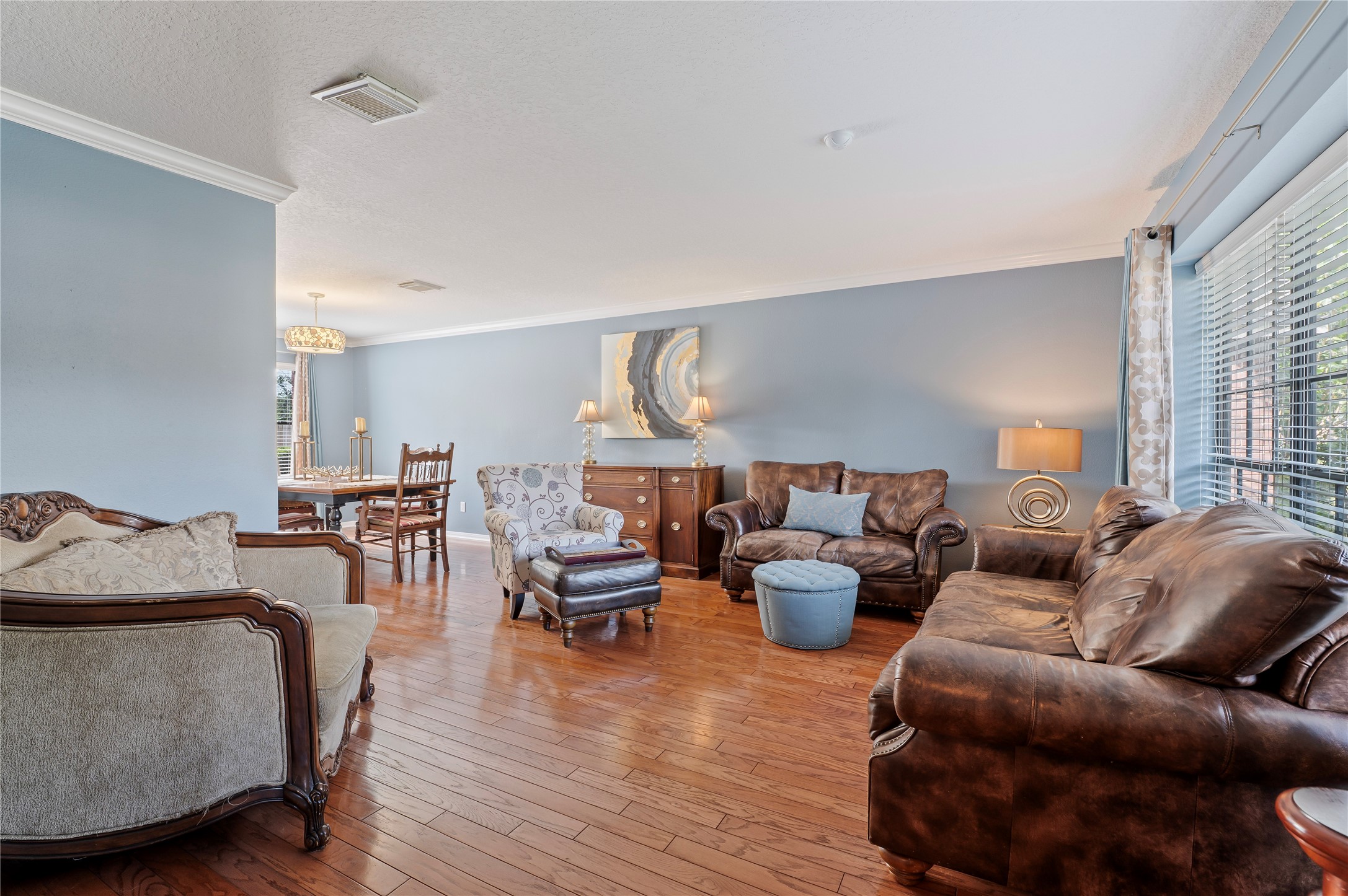The blue formal living room just off the entry flows right into the formal dining room. Fantastic floor plan for entertaining!