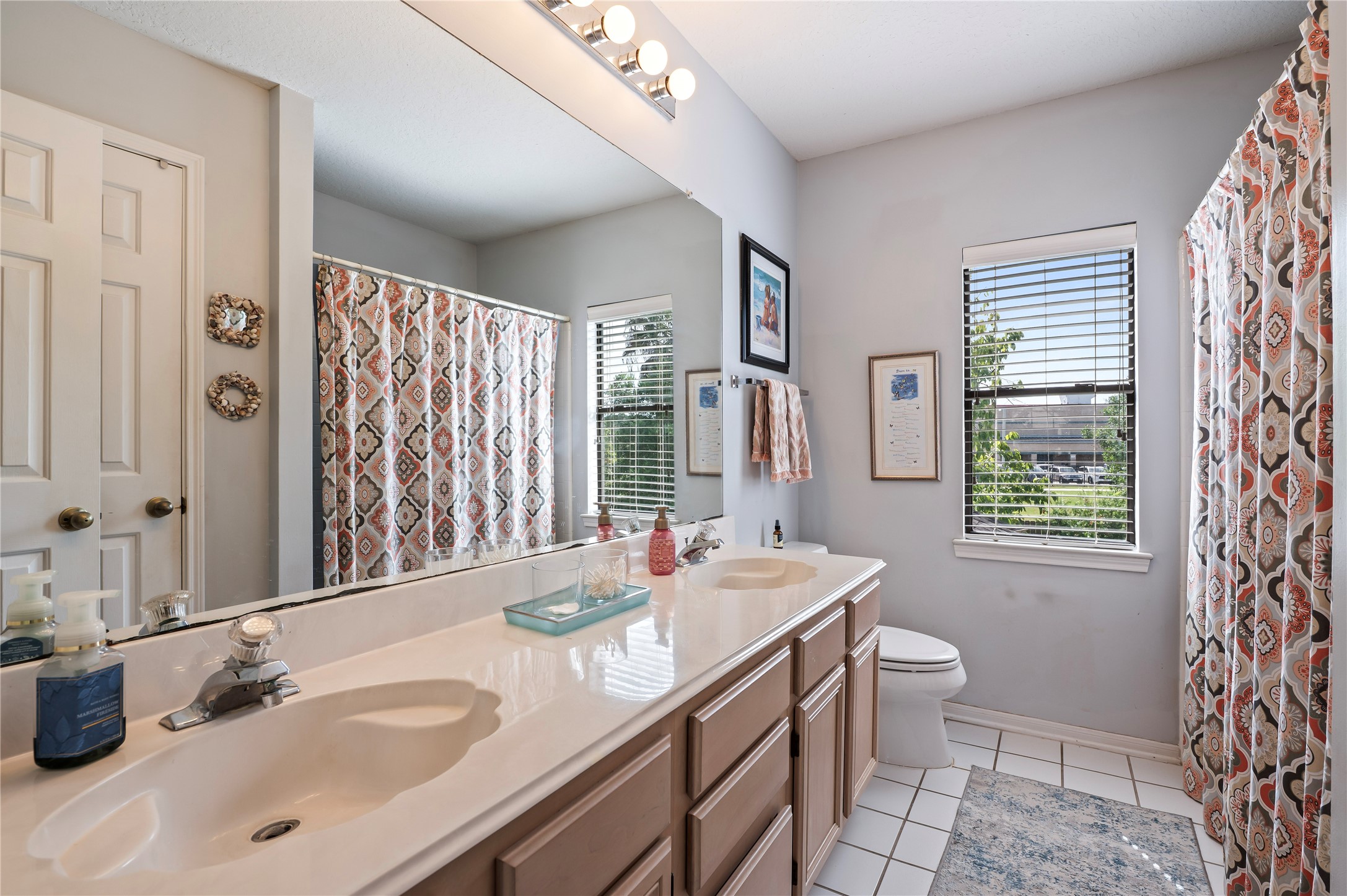 The secondary bath upstairs has double sinks and a tub/shower combo.