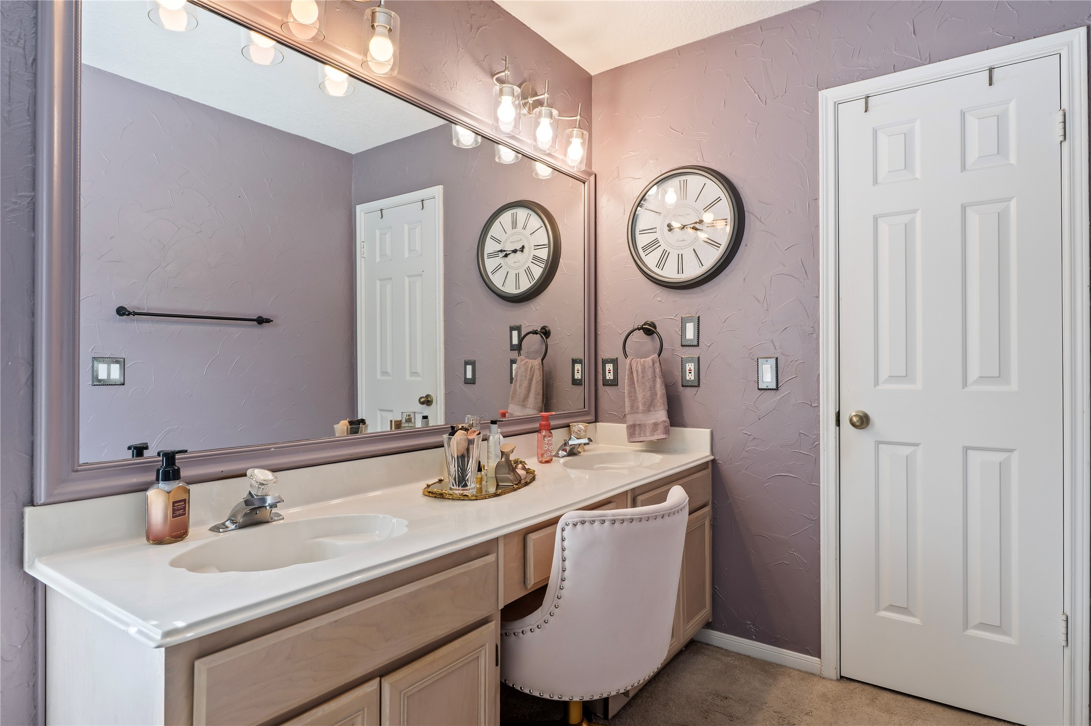 Double sinks and a sit-down vanity give you plenty of room to get ready.