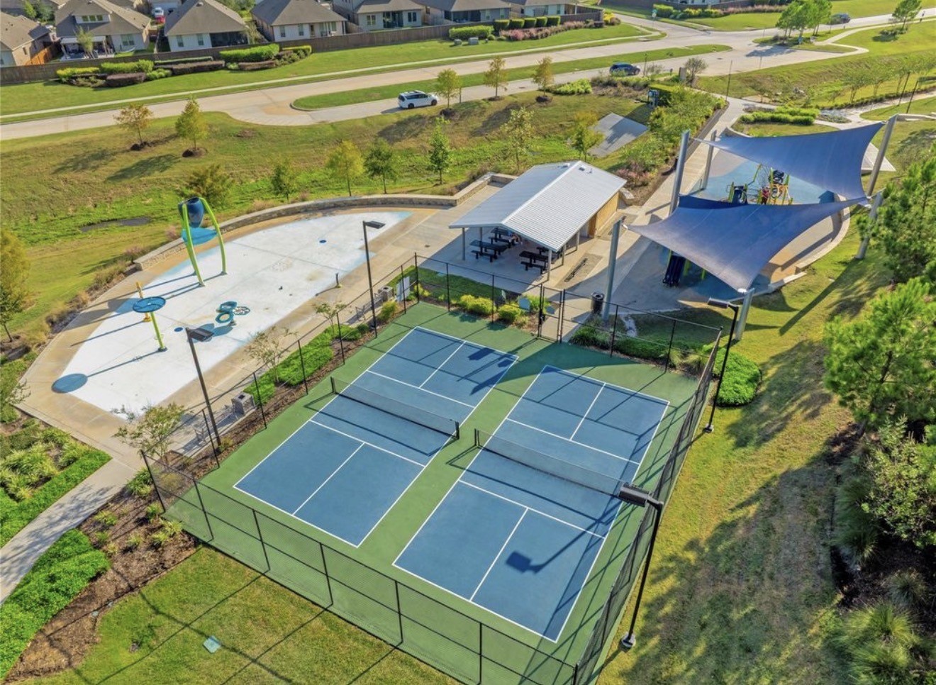 Enjoy a vibrant community lifestyle with access to tennis courts, a splash pad, and a shaded playground, perfect for family recreation and relaxation.