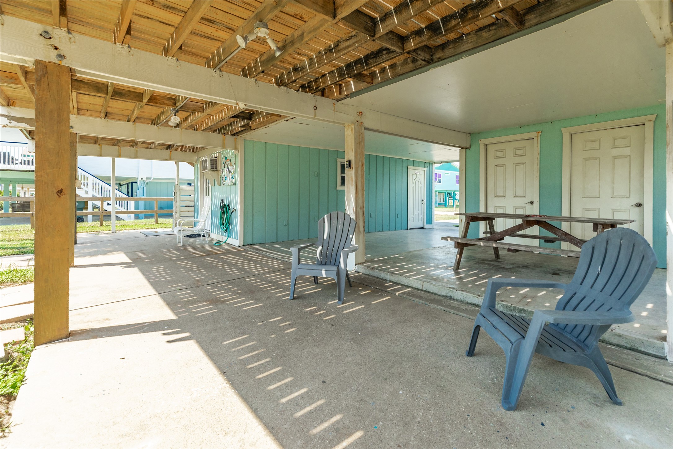 Ground level shaded area for enjoying gulf breezes, naps and day on the hammock.