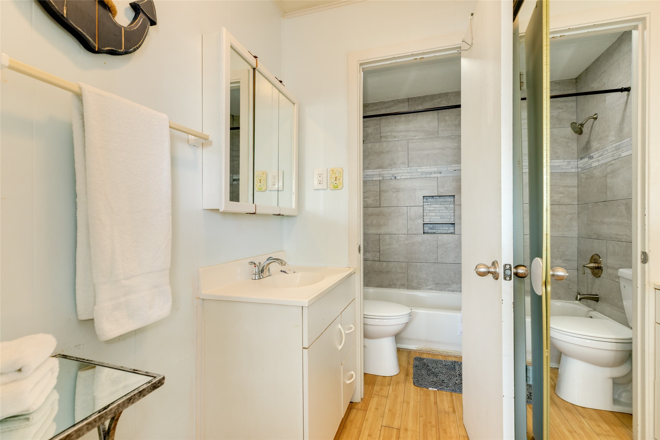 Primary bathroom with updated decorative tile.