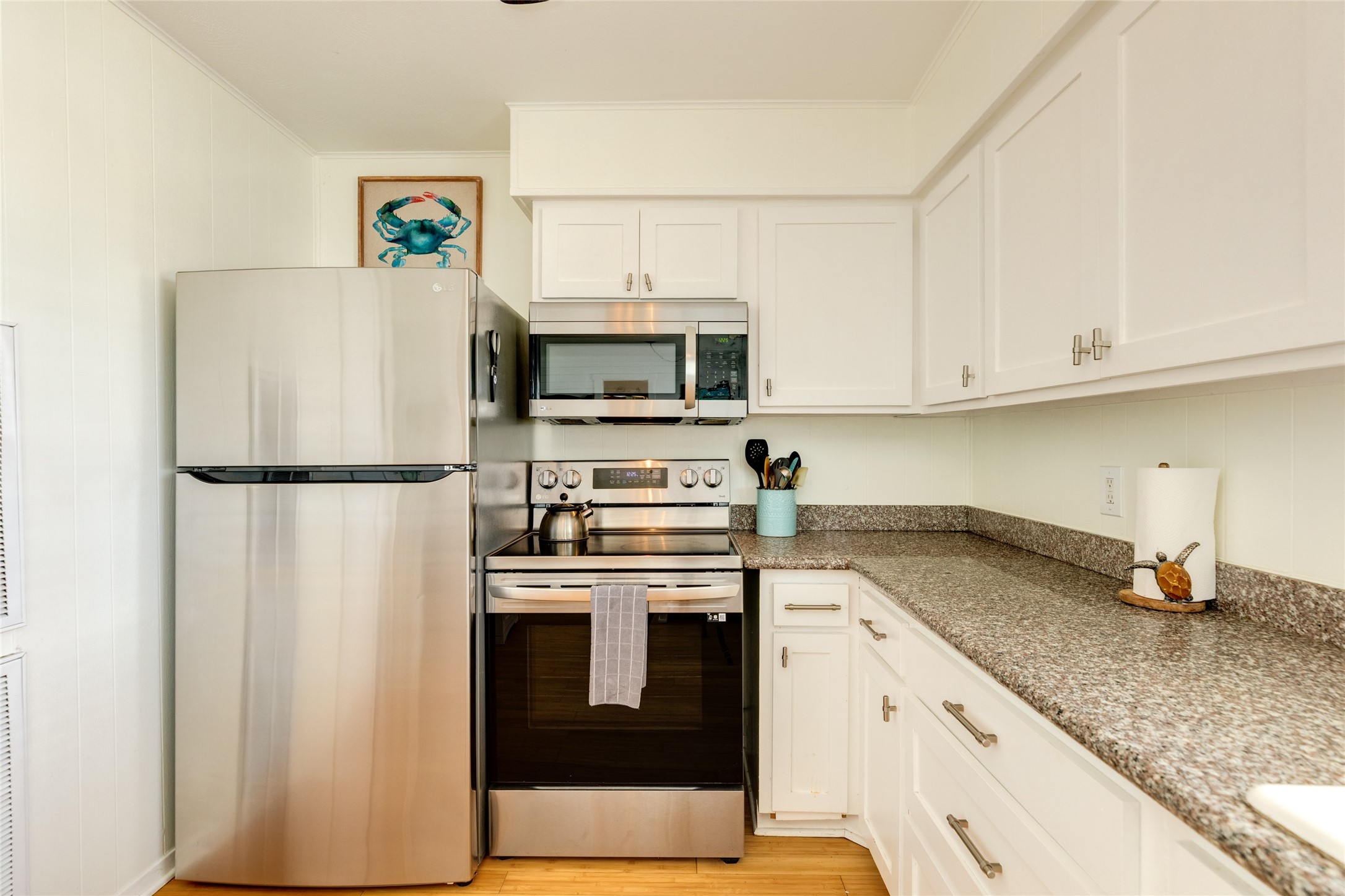 Stainless appliances with electric range.