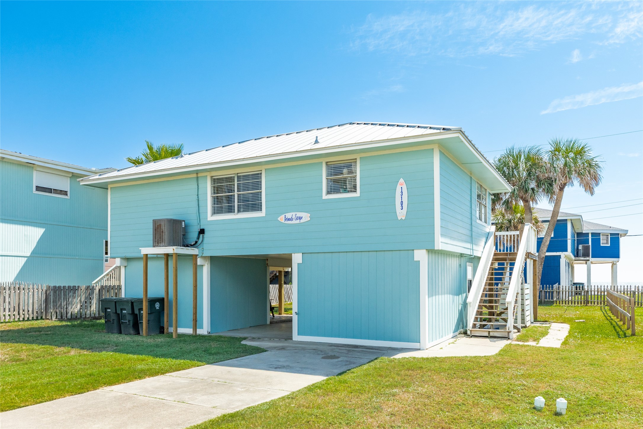 Front of home with hardi plank exterior and metal roof.
