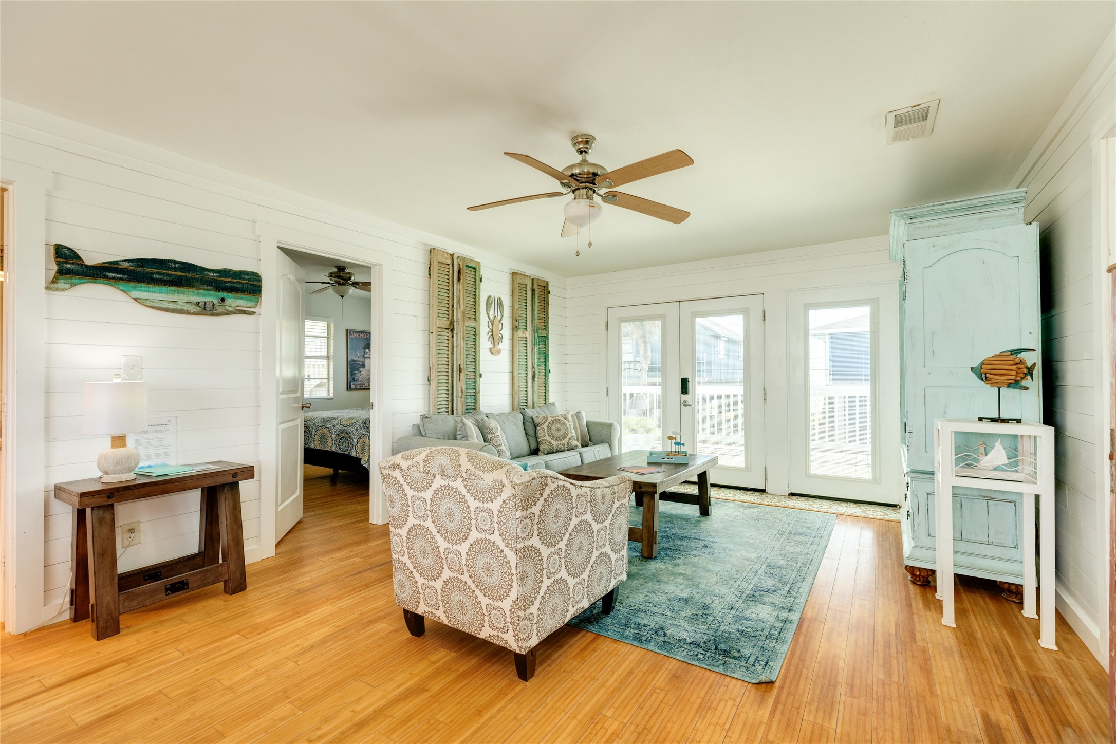 Front entrance into the living space with coastal chic decor, ship lap walls and relaxing coastal vibe while enjoying views of the Gulf.