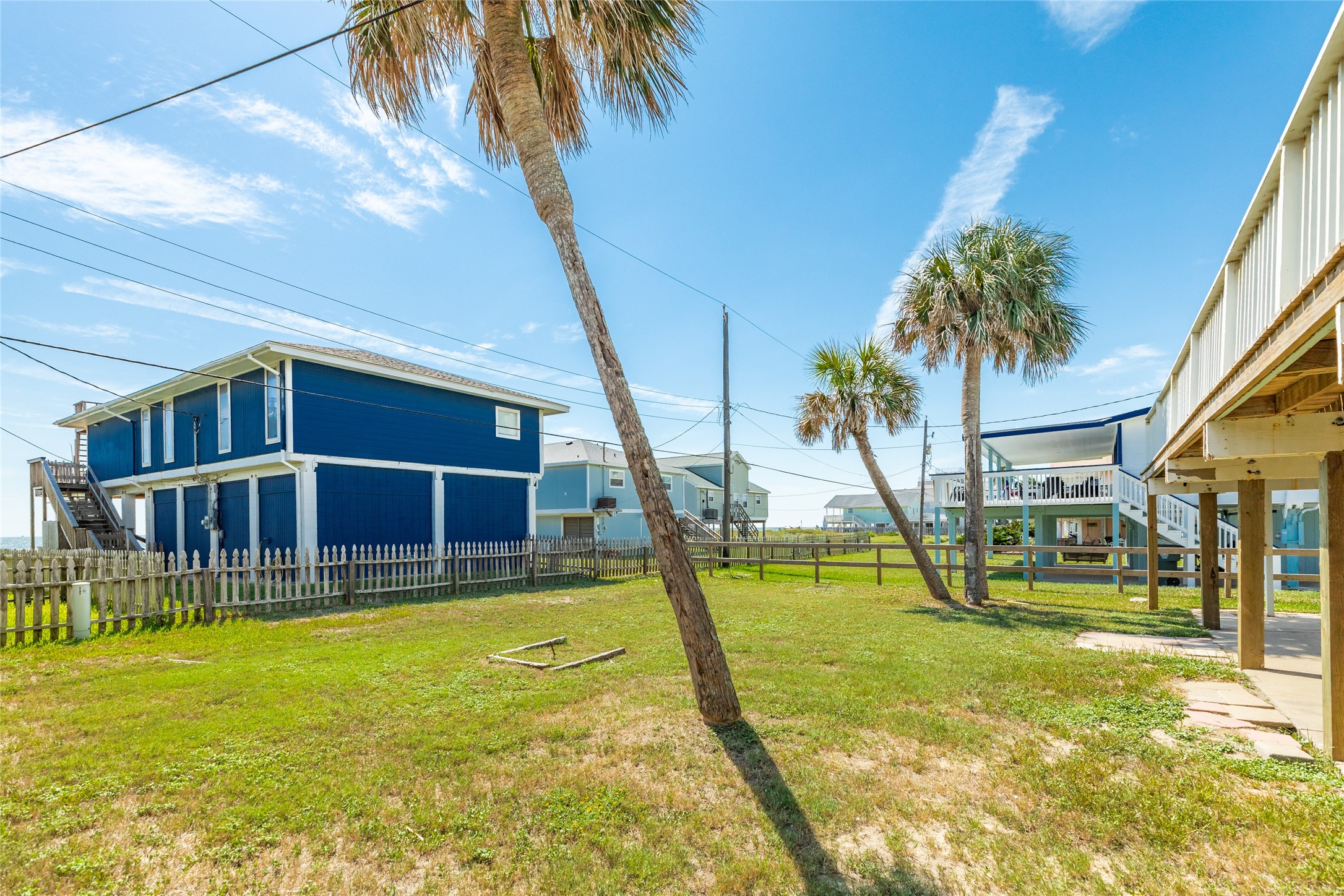 Spacious back yard with beach views.
