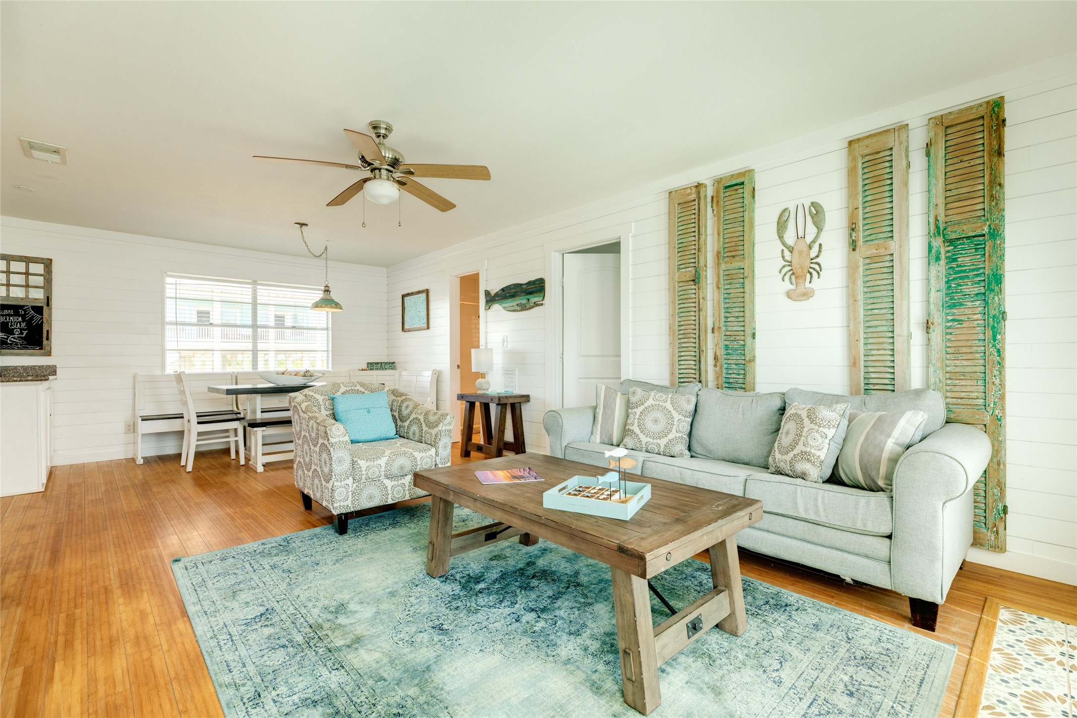 Coastal vibe in the living and dining space.