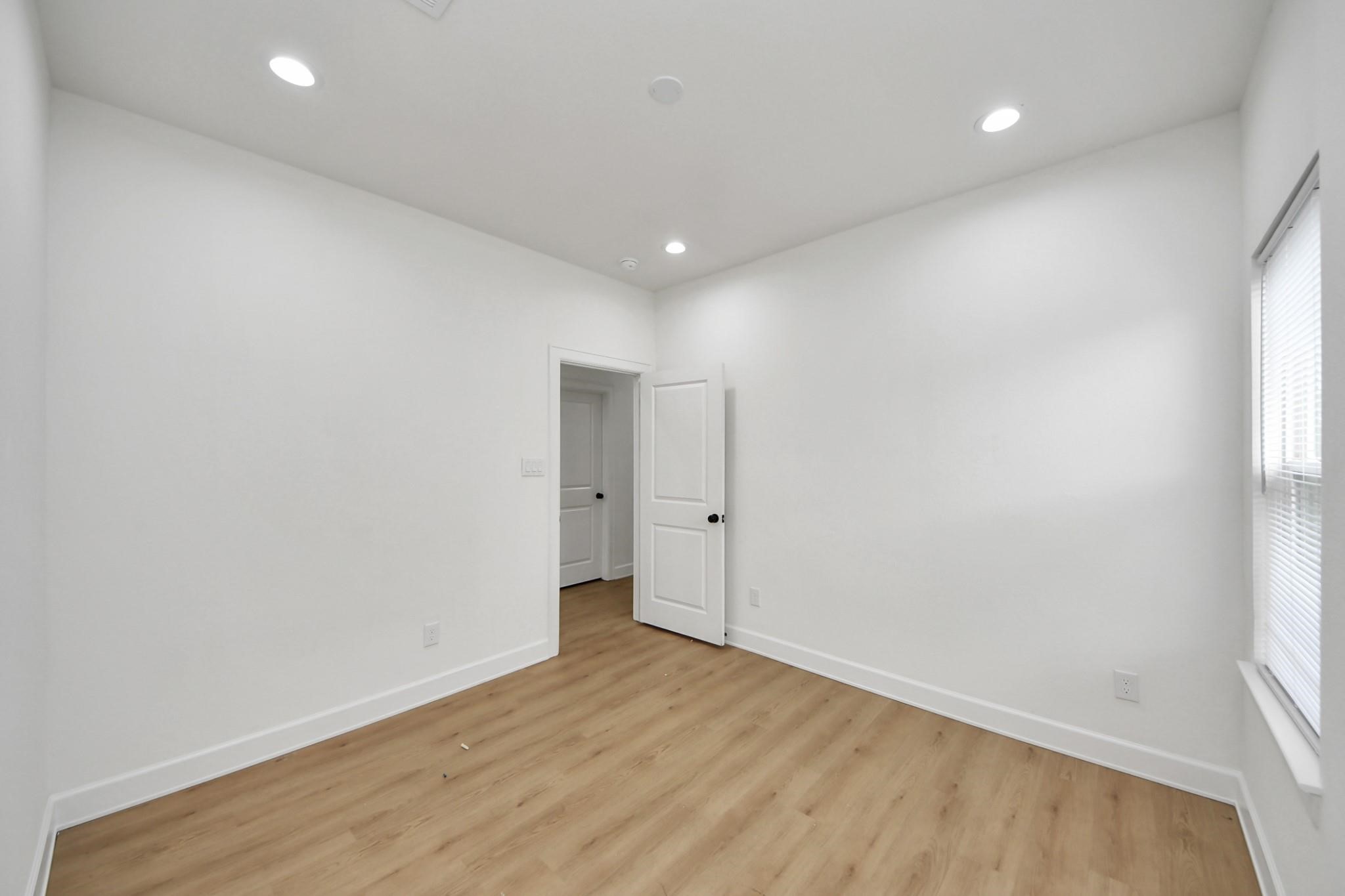 Whether used as a guest room or home office, this space offers modern comfort and simplicity.