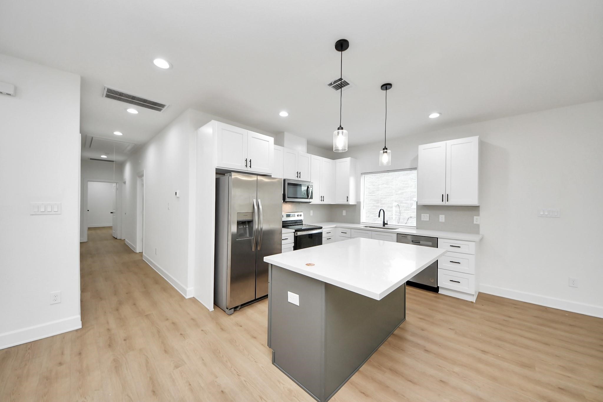The kitchen flows directly into the living space, embracing a true open-concept design. The kitchen flows directly into the living space, embracing a true open-concept design.