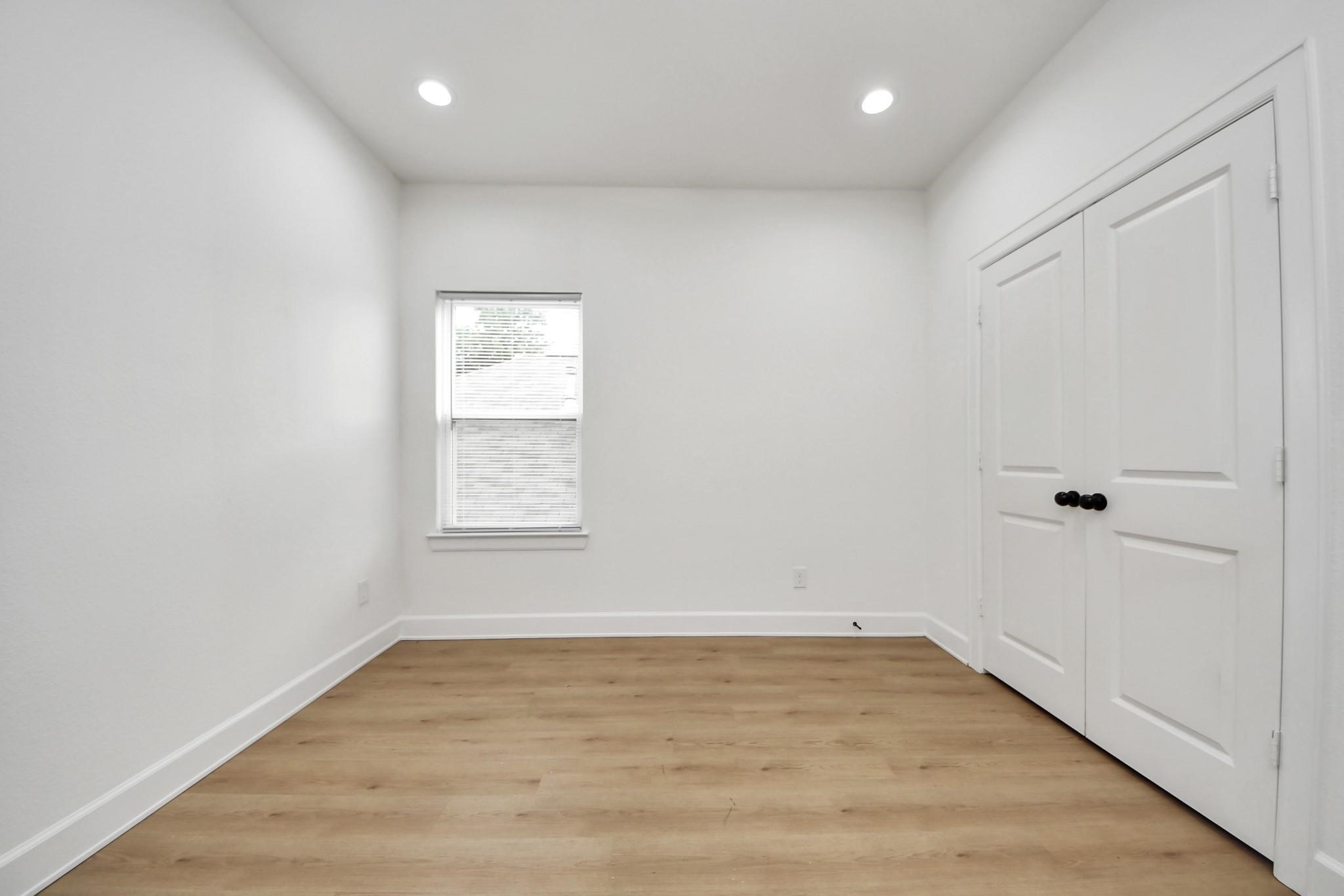 Ample closet storage and a functional layout make this room ideal for guests, a home office, or nursery.