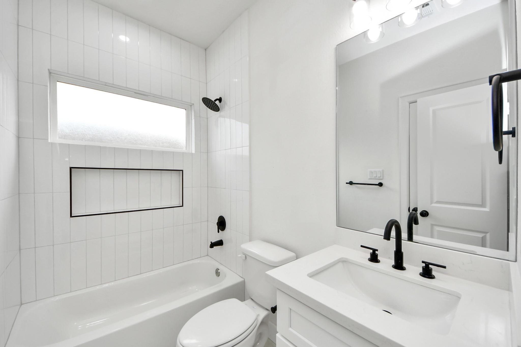 Clean lines and durable quartz counters complement the homes modern aesthetic.