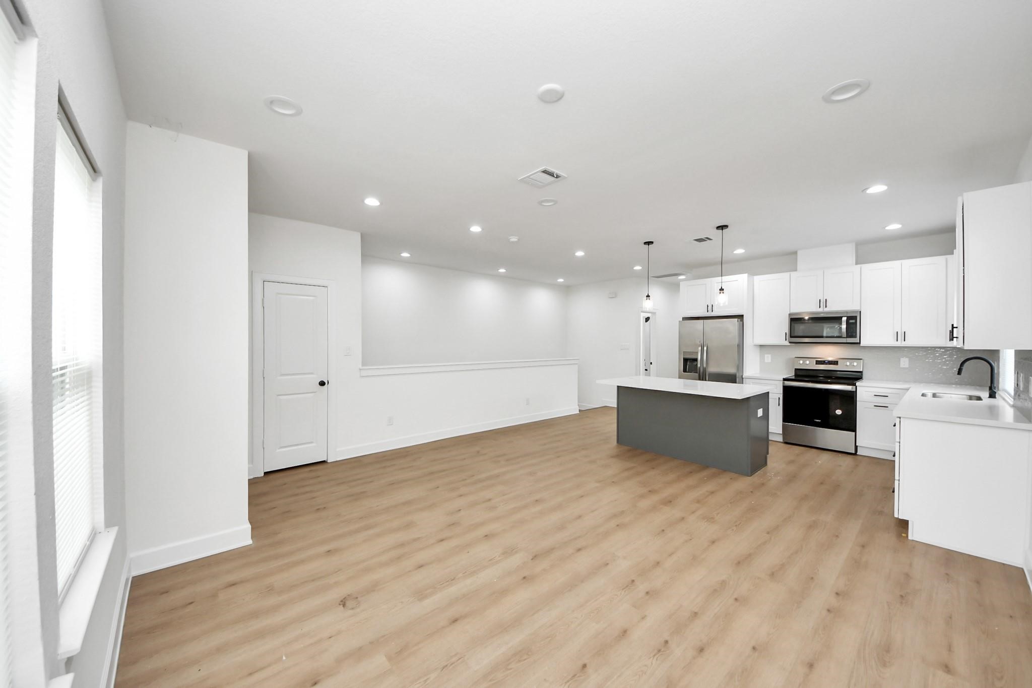 Enjoy a true open-concept layout where the living room flows seamlessly into the kitchen and dining space. Enjoy a true open-concept layout where the living room flows seamlessly into the kitchen and dining space.