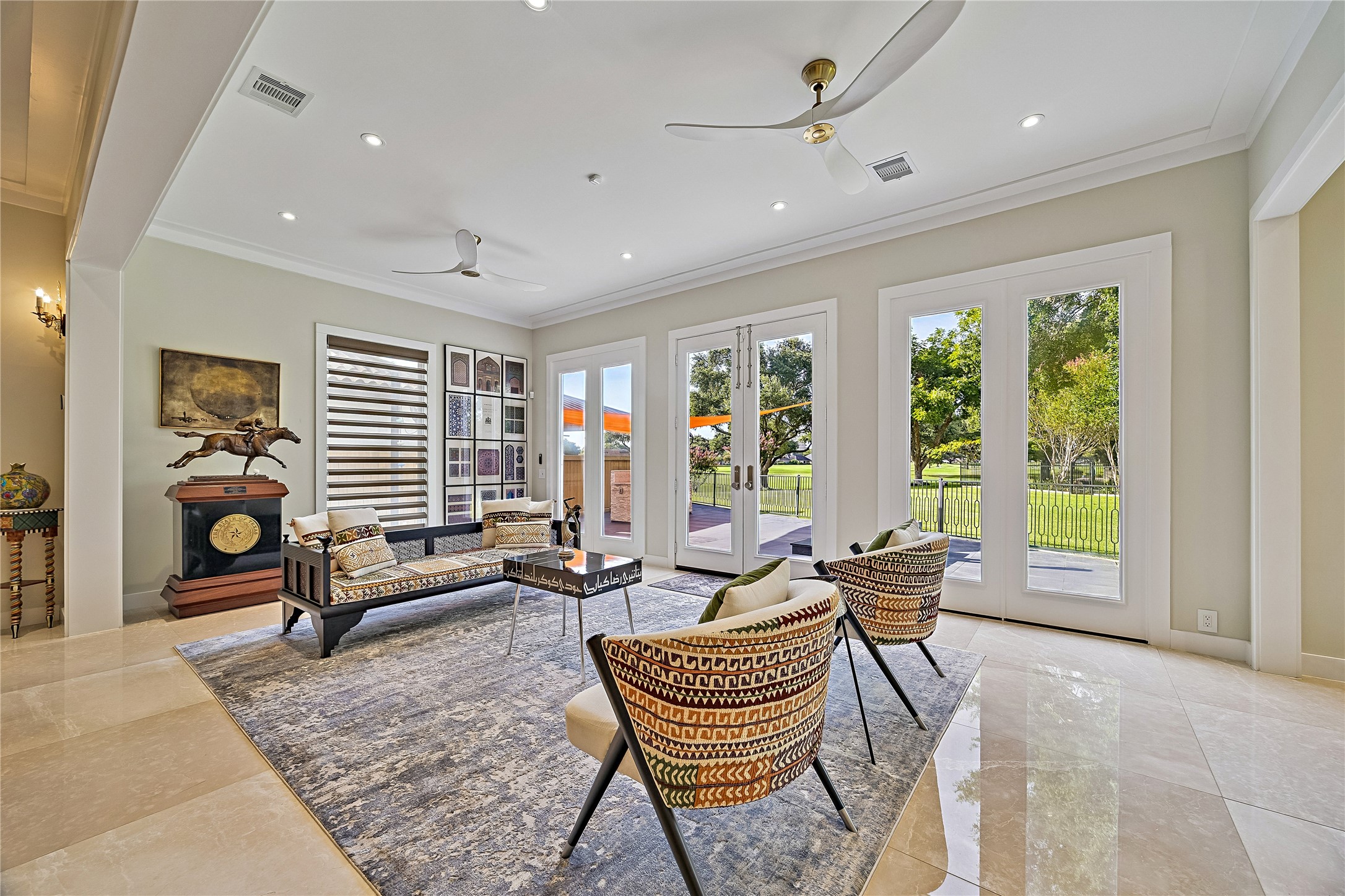 The home's great room, highlights the seamless connection between gathering spaces, contemporary finishes, and carefully designed interior sight lines.