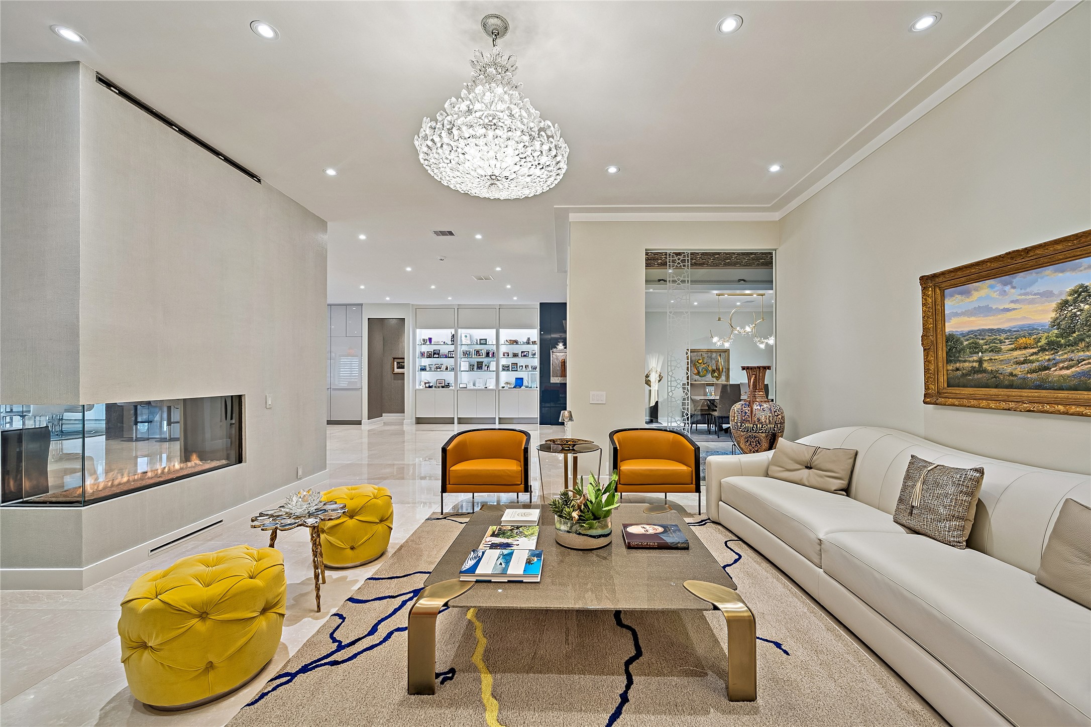 Sophisticated interior gathering space featuring comfortable seating, elegant finishes, and an inviting atmosphere. The home's interconnected living areas provide flexibility for both intimate gatherings and larger-scale entertaining.