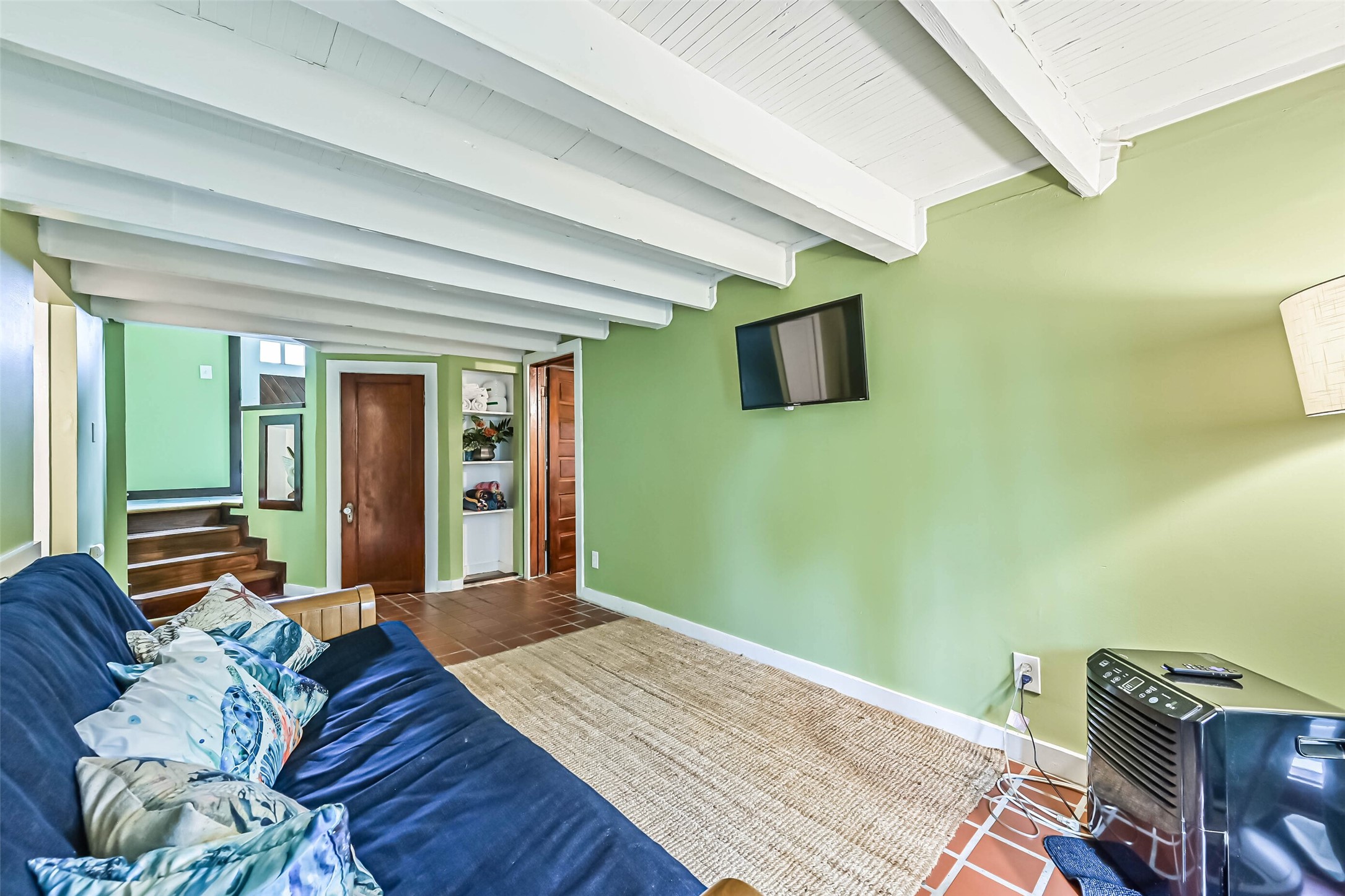A comfortable living space filled with natural light, perfect for relaxing and spending time together.