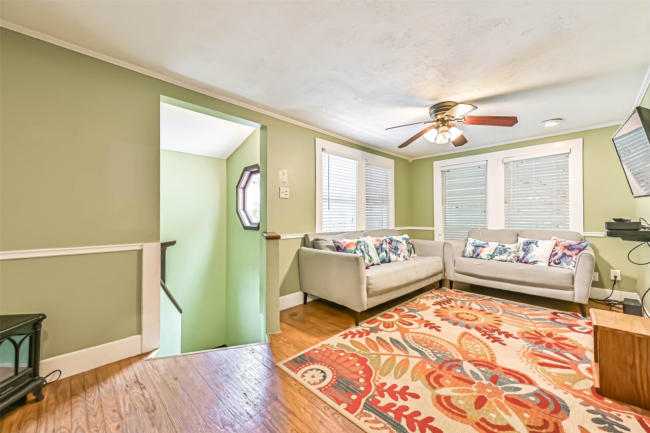 A welcoming living room with comfortable seating and decorative details, creating a relaxing space to gather.