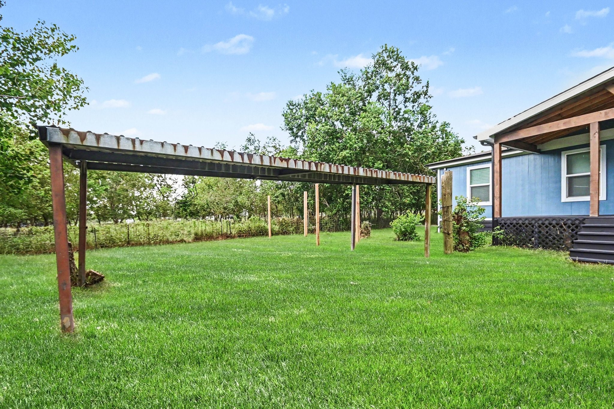 Covered patio for animals, tractor, etc.