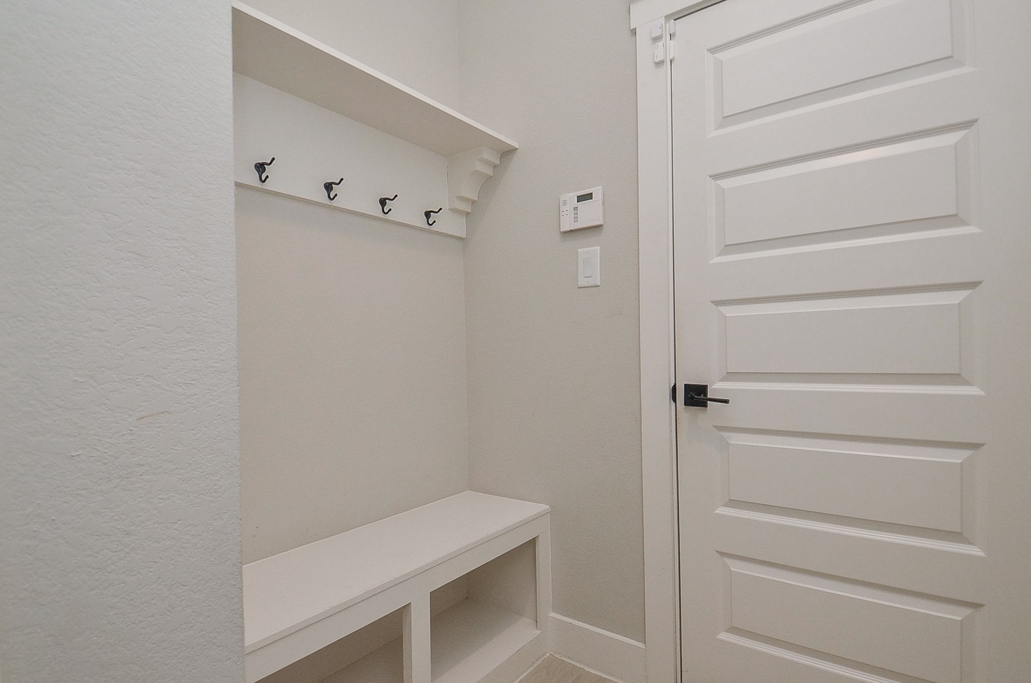 Built-in drop zone adds practical organization for bags, shoes and daily essentials.