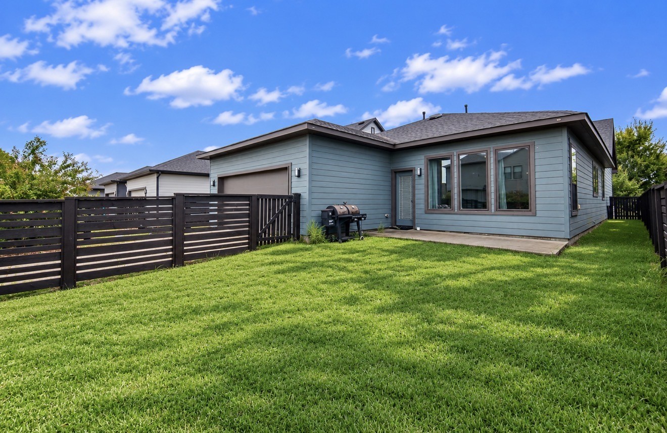 Expansive backyard offers room to play, entertain and unwind with neighborhood recreation just moments away.
