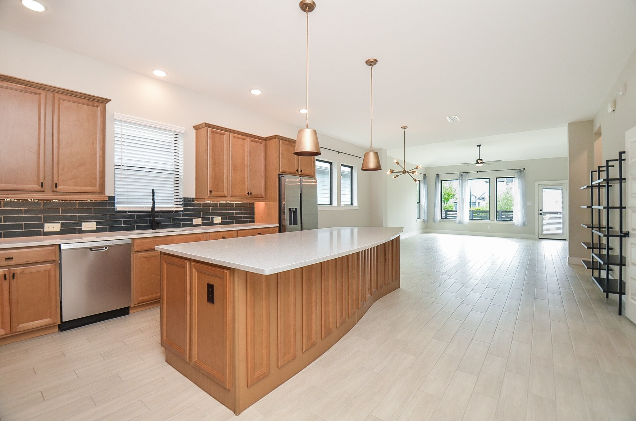 Well-appointed kitchen features a substantial center island, extensive cabinetry and abundant workspace.