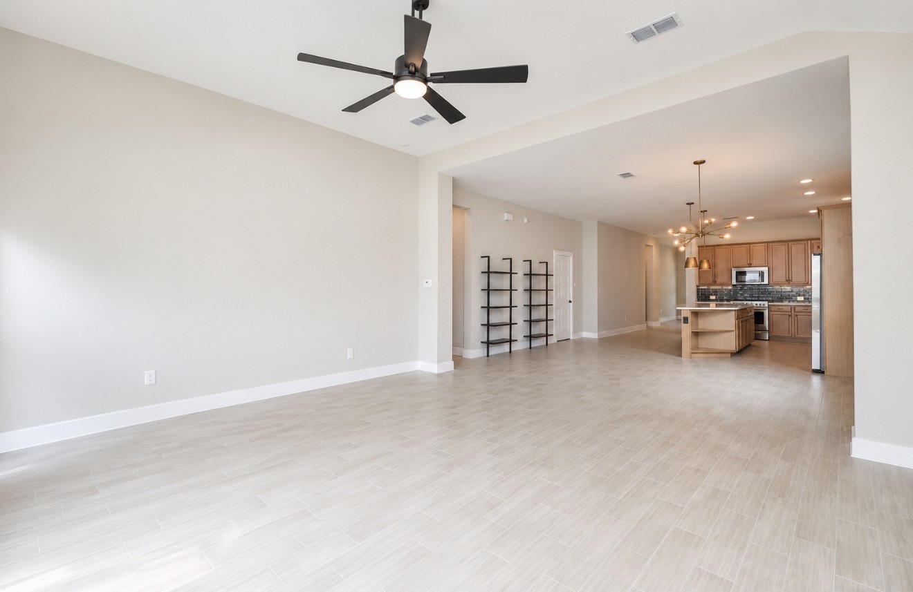 Wide interior sightlines emphasize the homes connected design and easy movement between spaces.