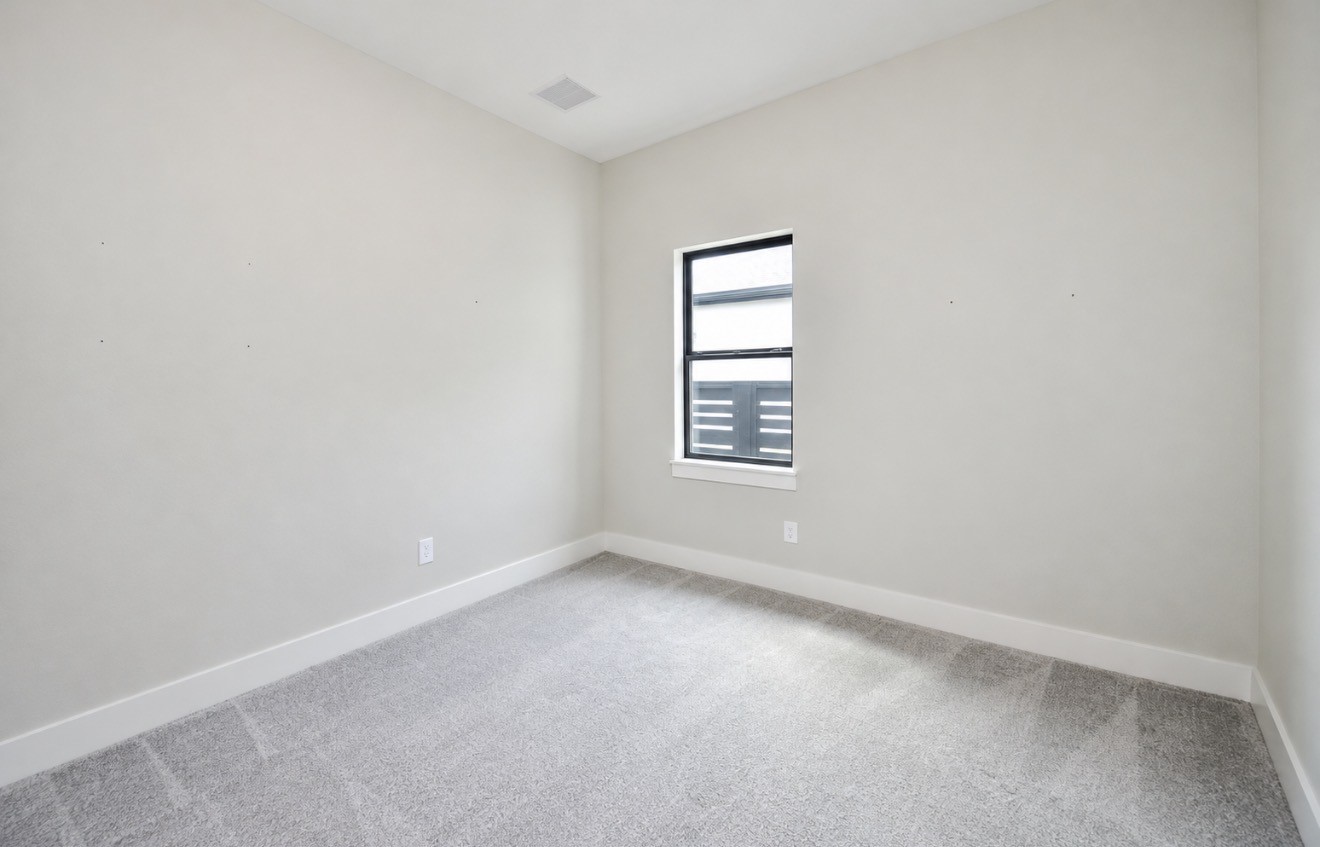 Well-proportioned bedroom provides privacy and an easy-to-personalize neutral palette.