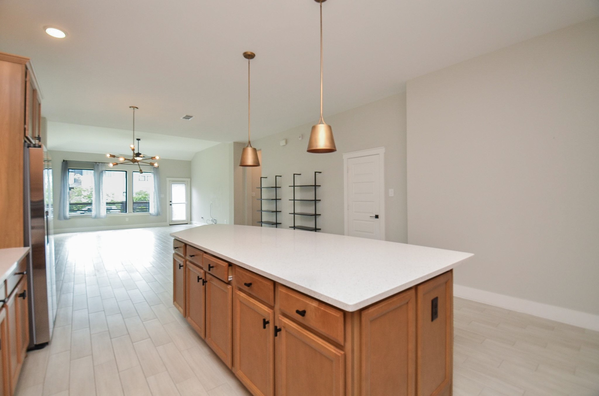 Additional kitchen perspective highlights plentiful counter space and convenient access to adjoining areas.