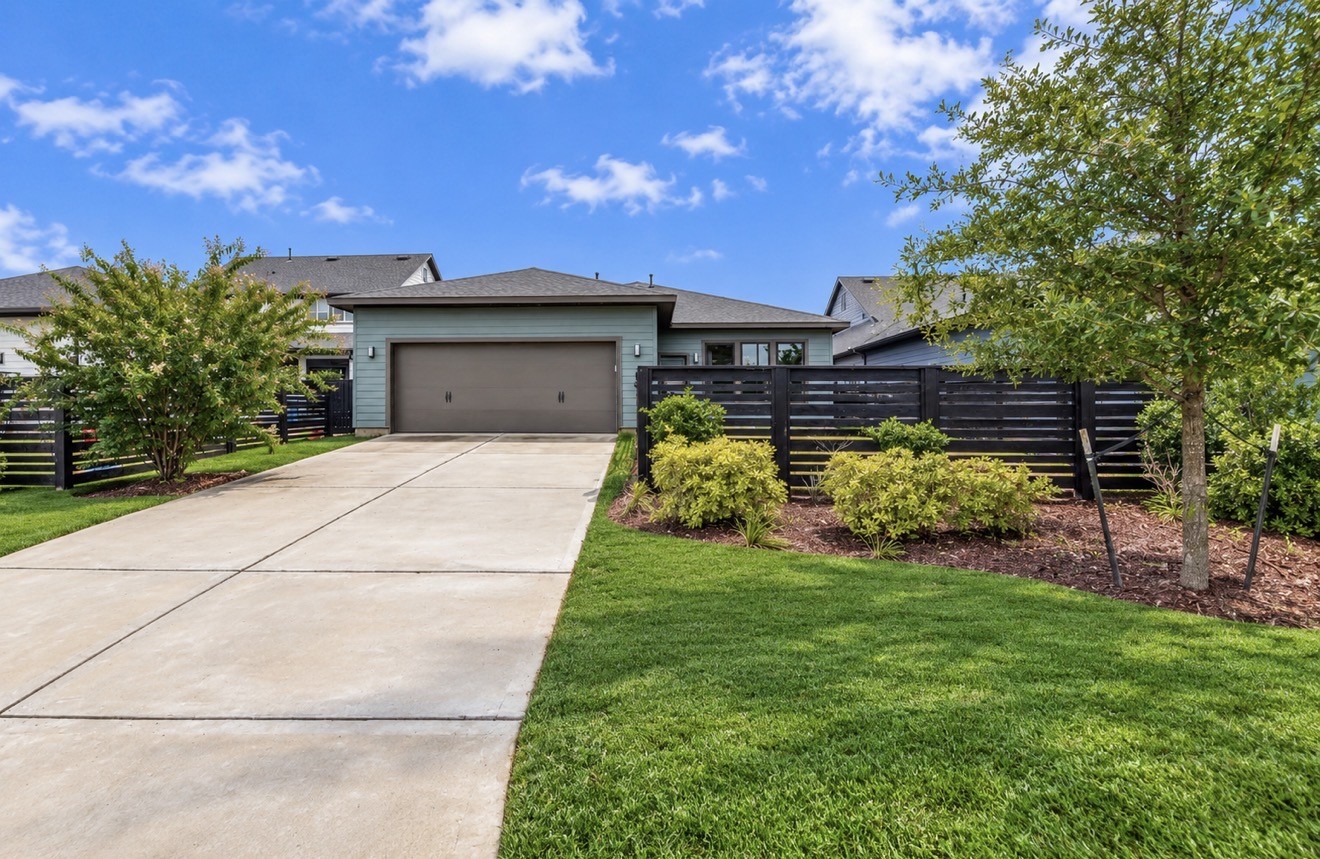 Rear exterior highlights the generous homesite and exceptional proximity to Celebration Park.