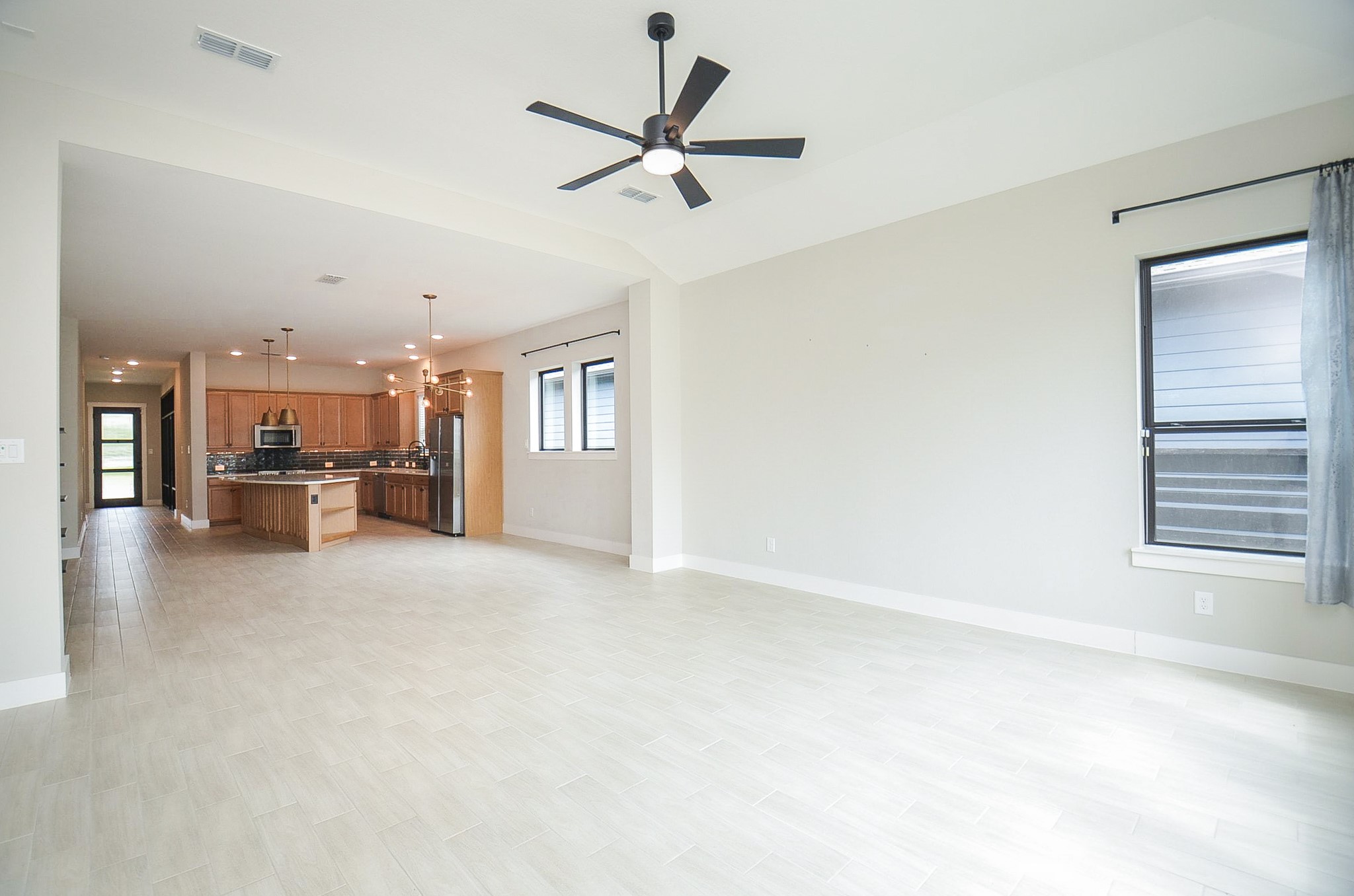 Expansive open living area with seamless flow into the kitchen.