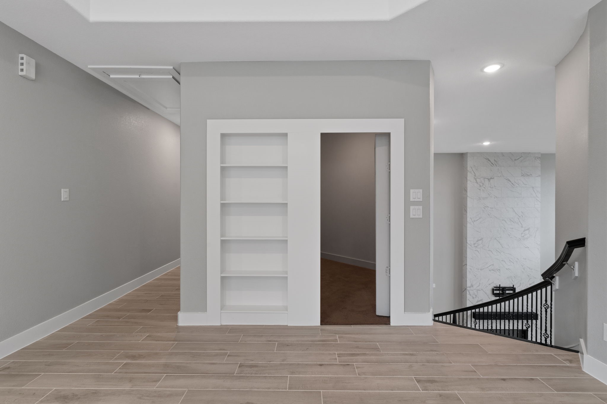 Spacious upstairs hallway with additional storage and functional layout.