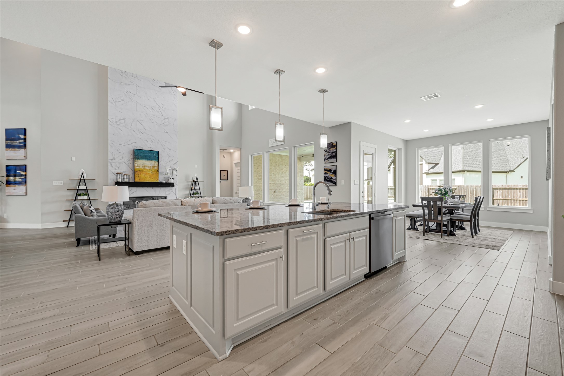 Expansive kitchen with oversized island and abundant workspace.